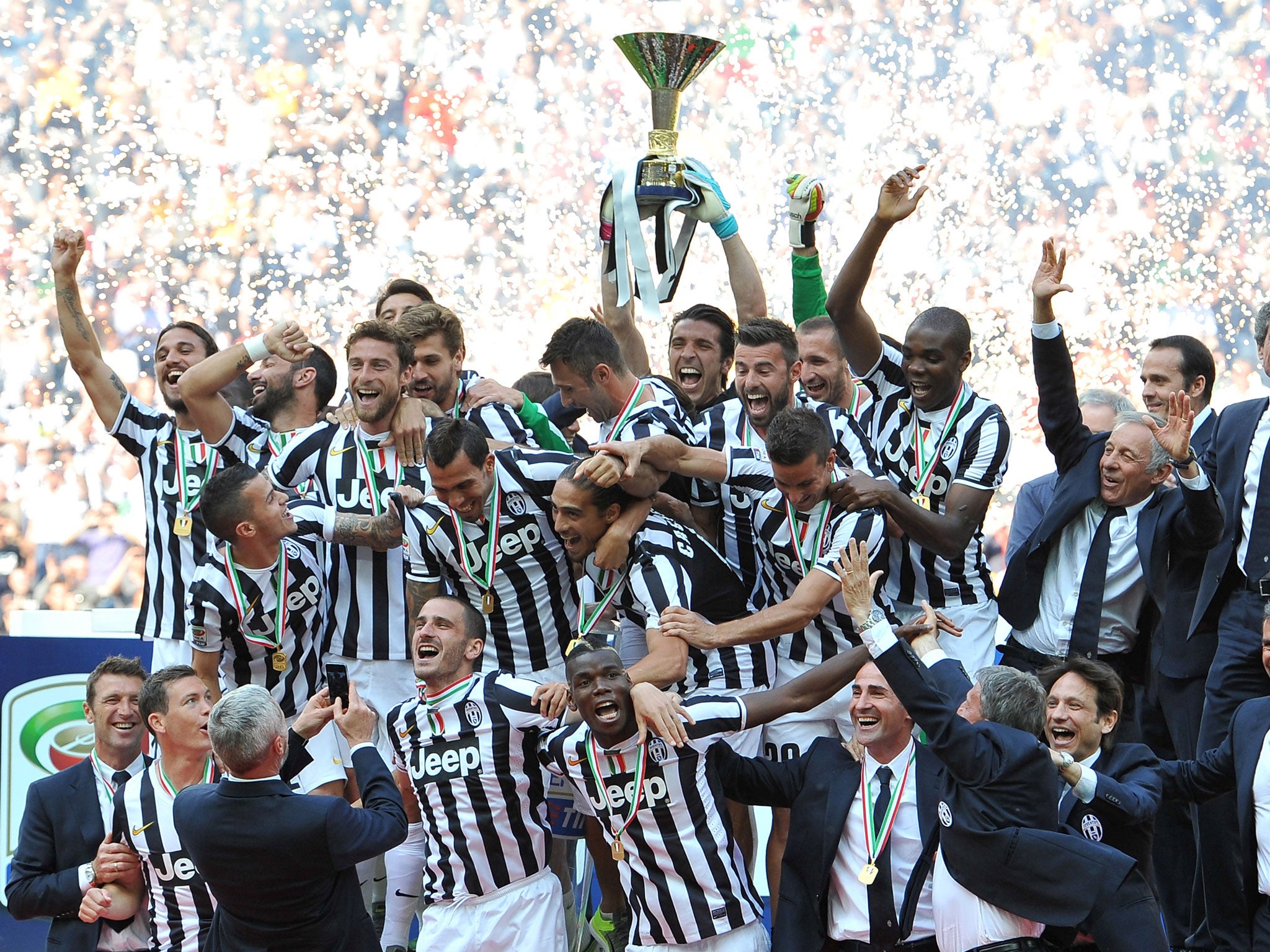 Juventus FC players celebrate with the Serie A trophy at the end of the Serie A match between Juventus and Cagliari