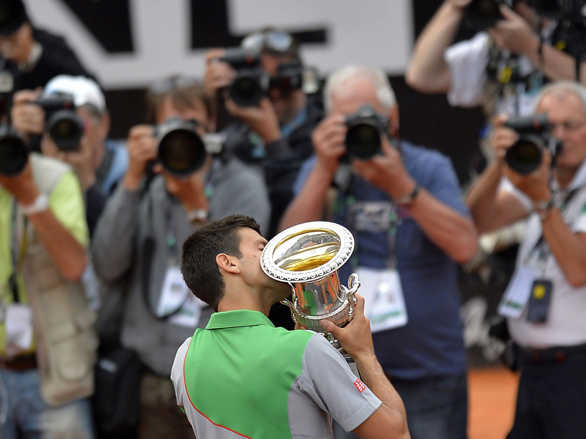 Novak Djokovic of Serbia kisses the trophy after winning the ATP Rome's Tennis Masters final