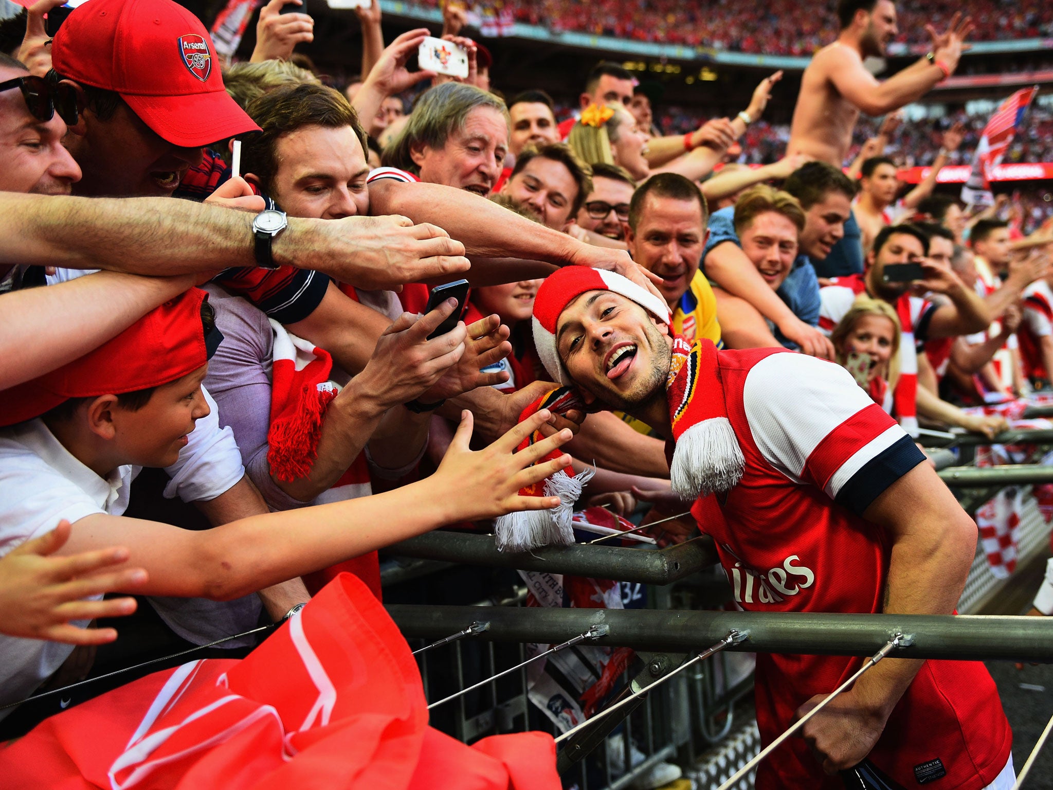 Jack Wilshere celebrates with Arsenal fans at Wembley