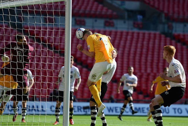 Liam Hughes opens the scoring for Cambridge at Wembley