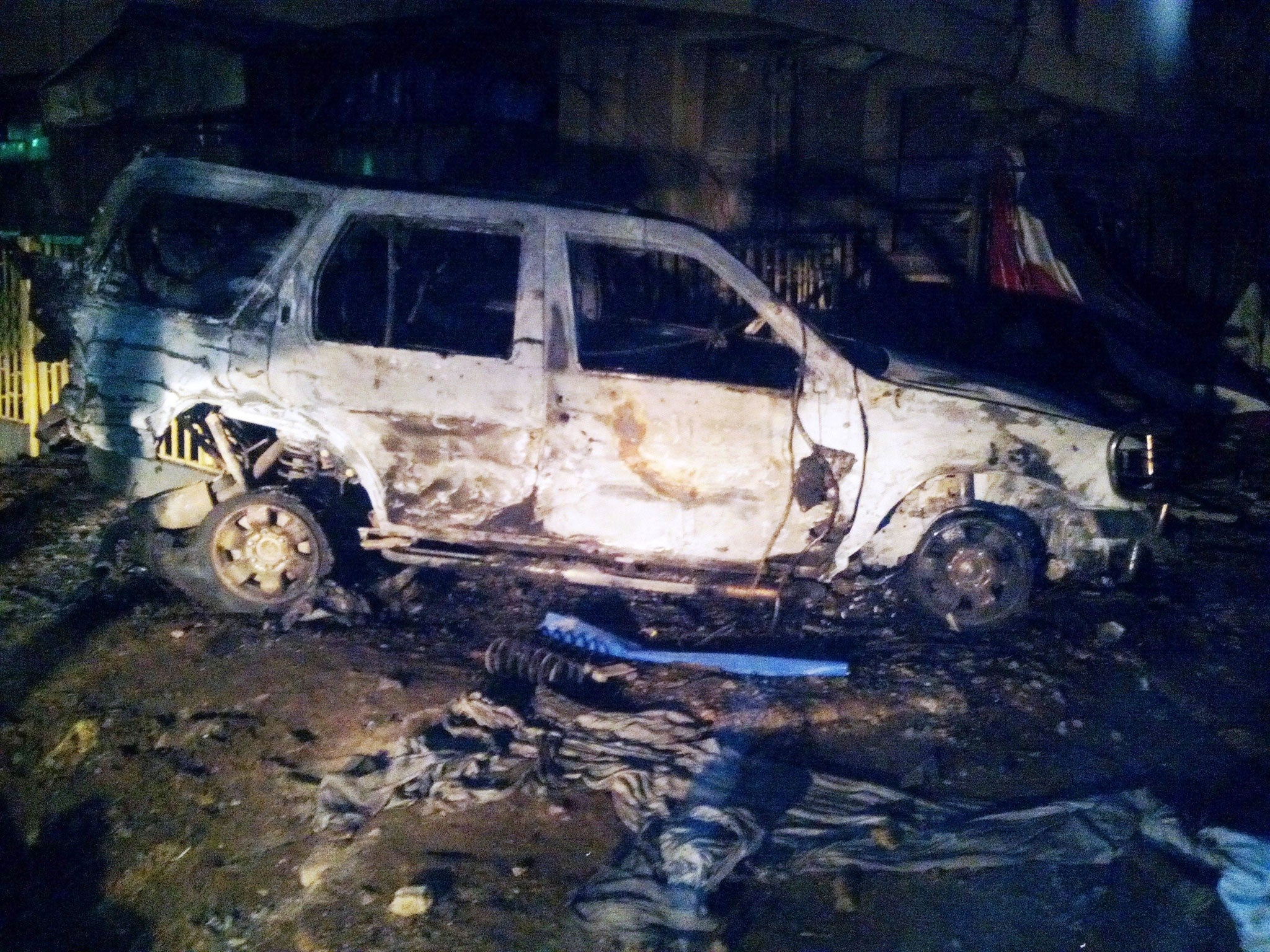The wreckage of a car at the scene of a suicide blast in Kano, northern Nigeria.