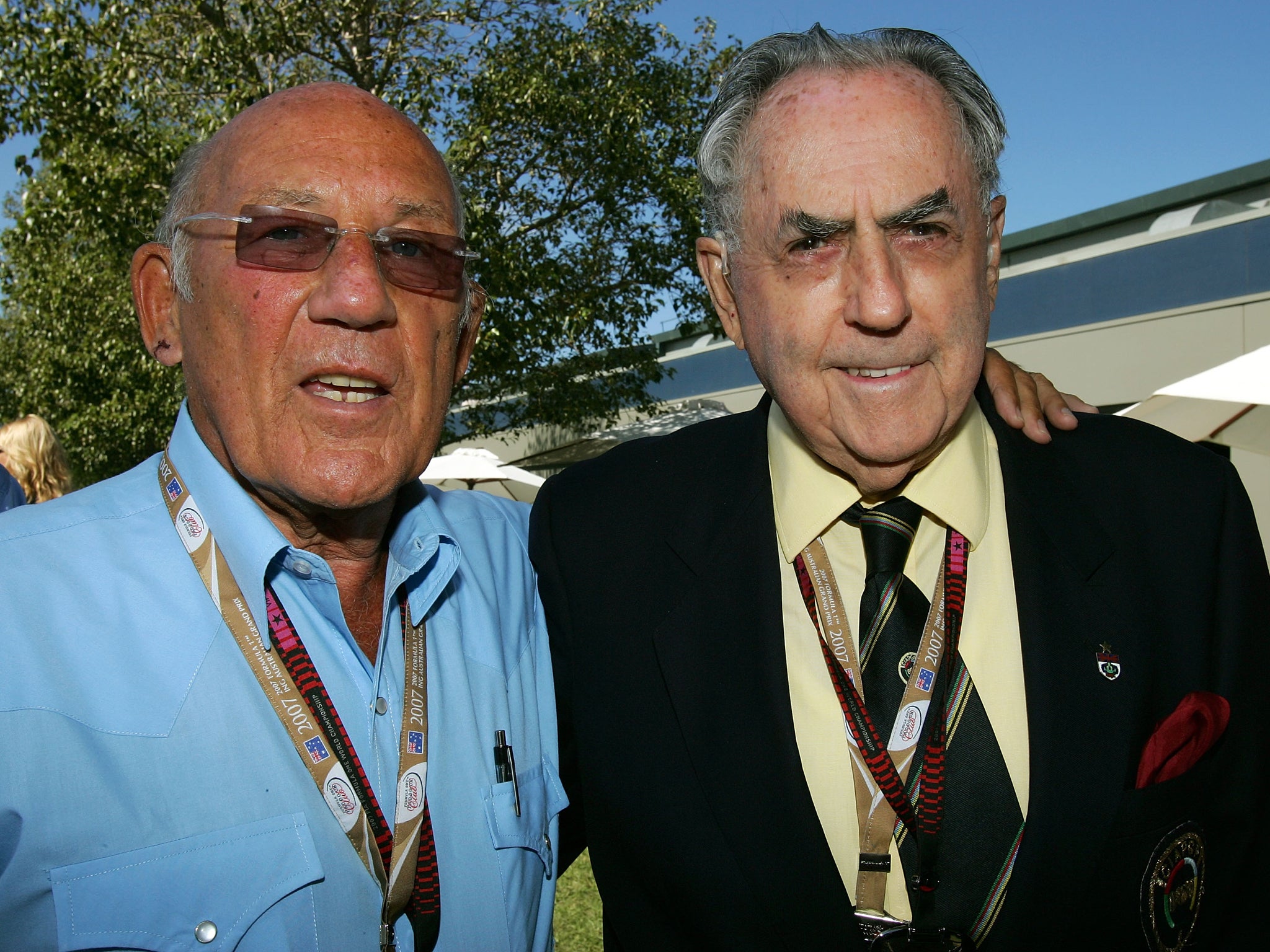 Former Formula One drivers Sir Stirling Moss of Great Britain and Sir Jack Brabham of Australia pose together at the Australian Formula One Grand Prix 2007