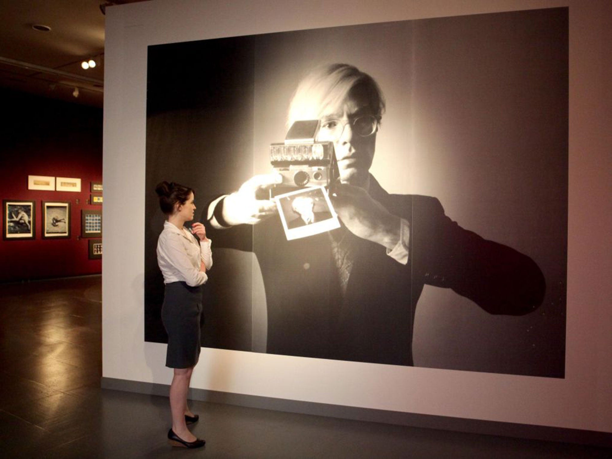 Instant appeal: A visitor examines a photo of Andy Warhol at a Polaroid exhibition in Germany