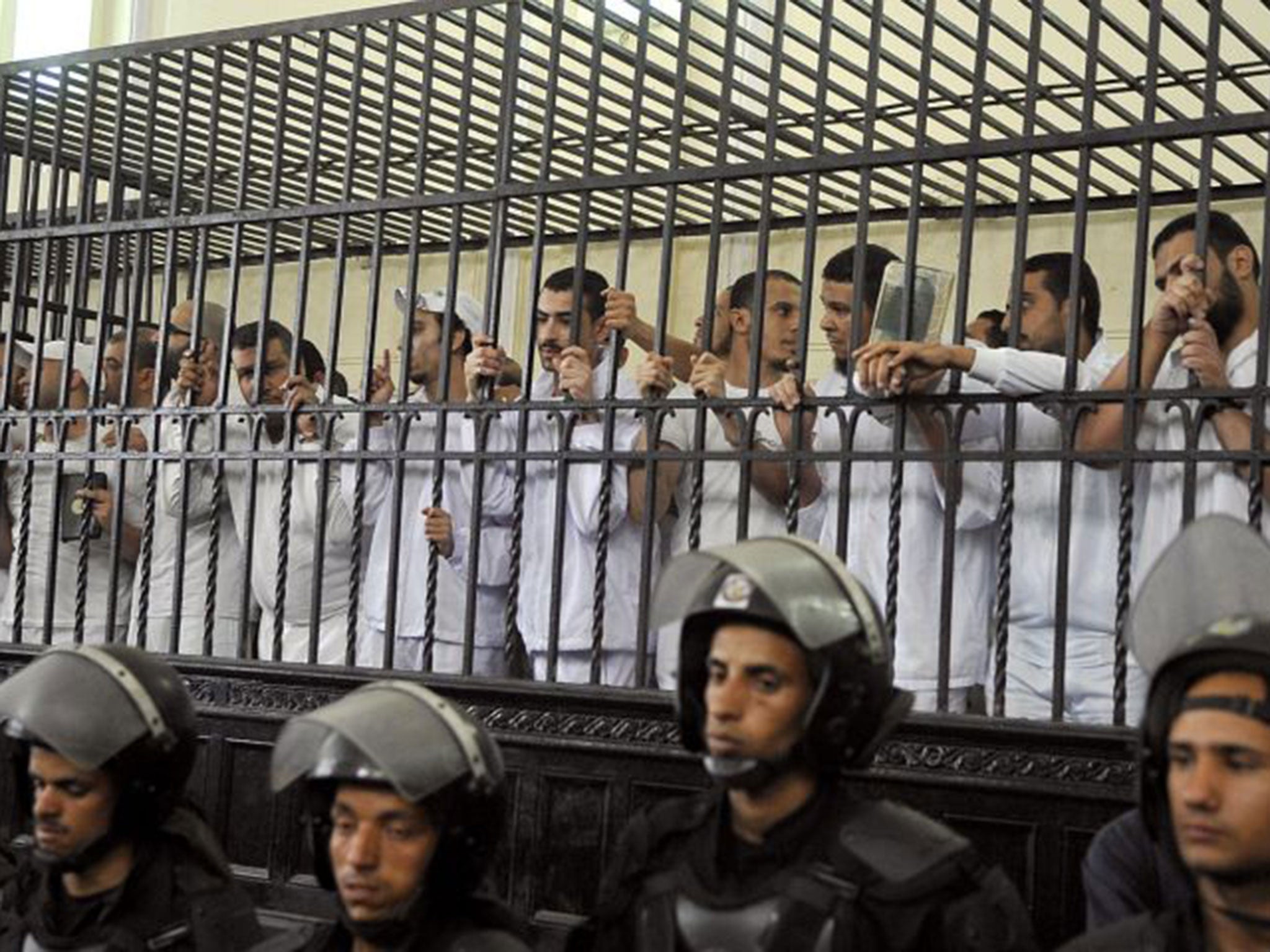 Defendants in court yesterday during their trial over violence in Alexandria last year following the ousting of Mohamed Morsi. Ahmed Diini was arrested shortly after Mr Morsi’s Muslim Brotherhood was deposed