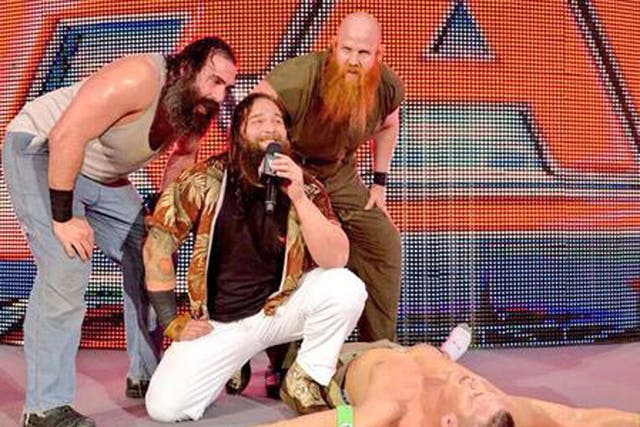 The Wyatt family stand over a beaten John Cena as Raw hits London