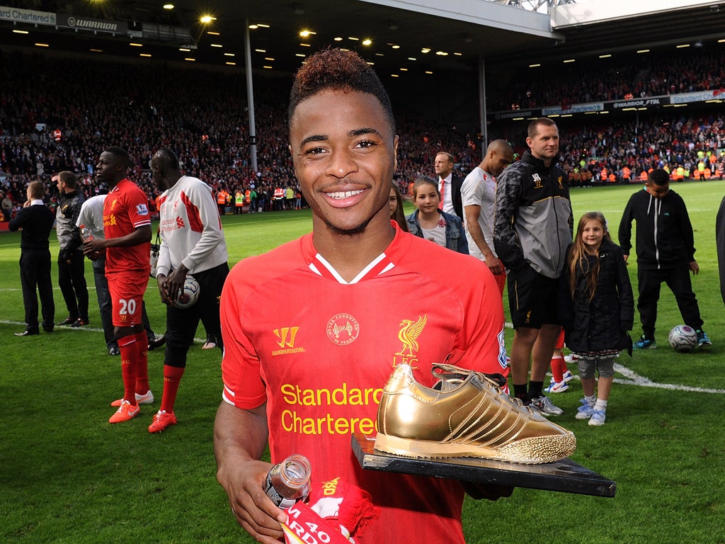 Raheem Sterling of Liverpool with a golden boot made by fans at the end of the Barclays Premier League match between Liverpool and Ne