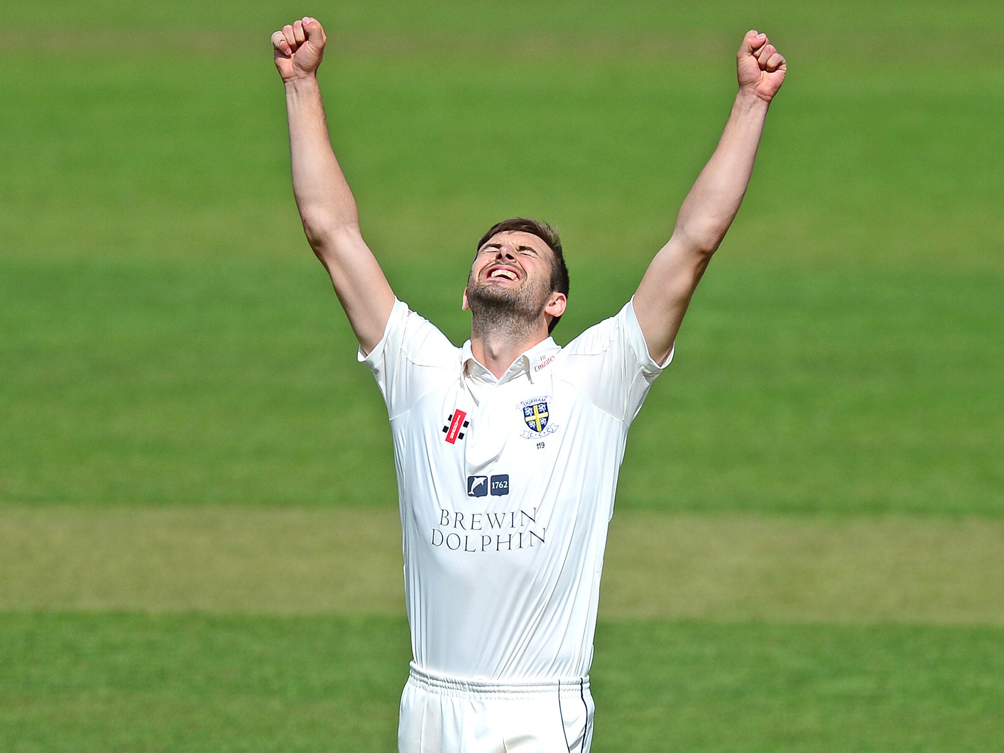 Durham’s Mark Wood celebrates taking his fifth wicket at Somerset