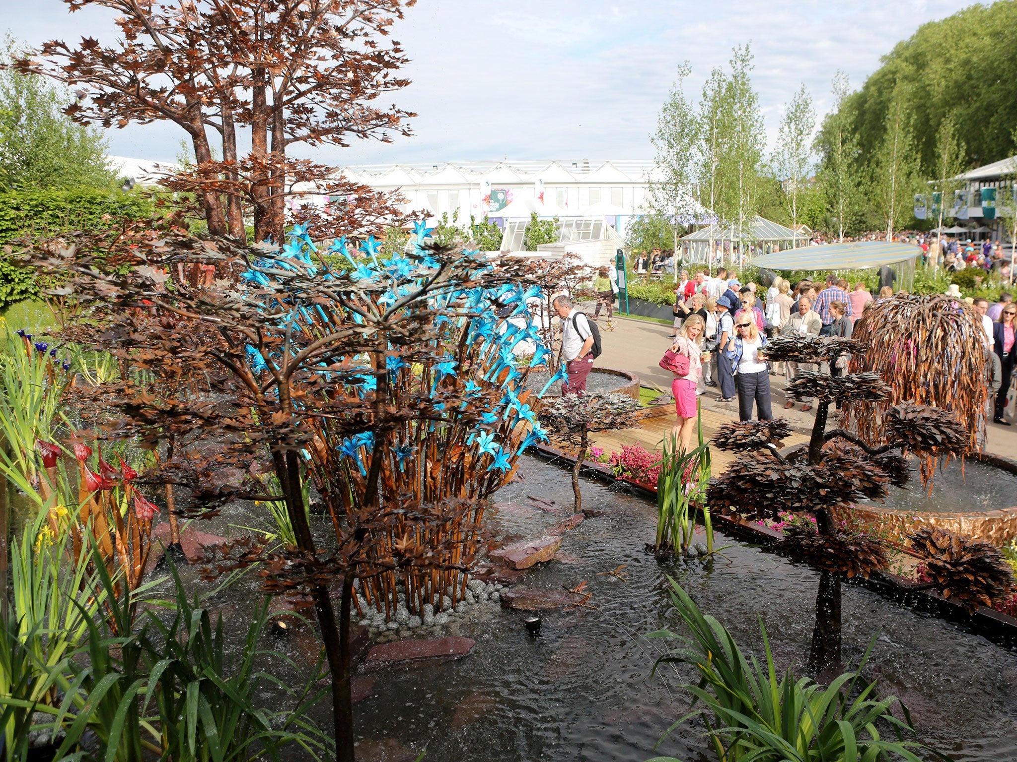 People walk around the RHS Chelsea Flower Show in the grounds of the Royal Hospital Chelsea in London 
