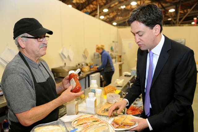 Ed Miliband buys a bacon sandwich from cafe owner Antonios Foufas at New Covent Garden Market in London as he kicks off a day of campaigning on the eve of the local and European elections