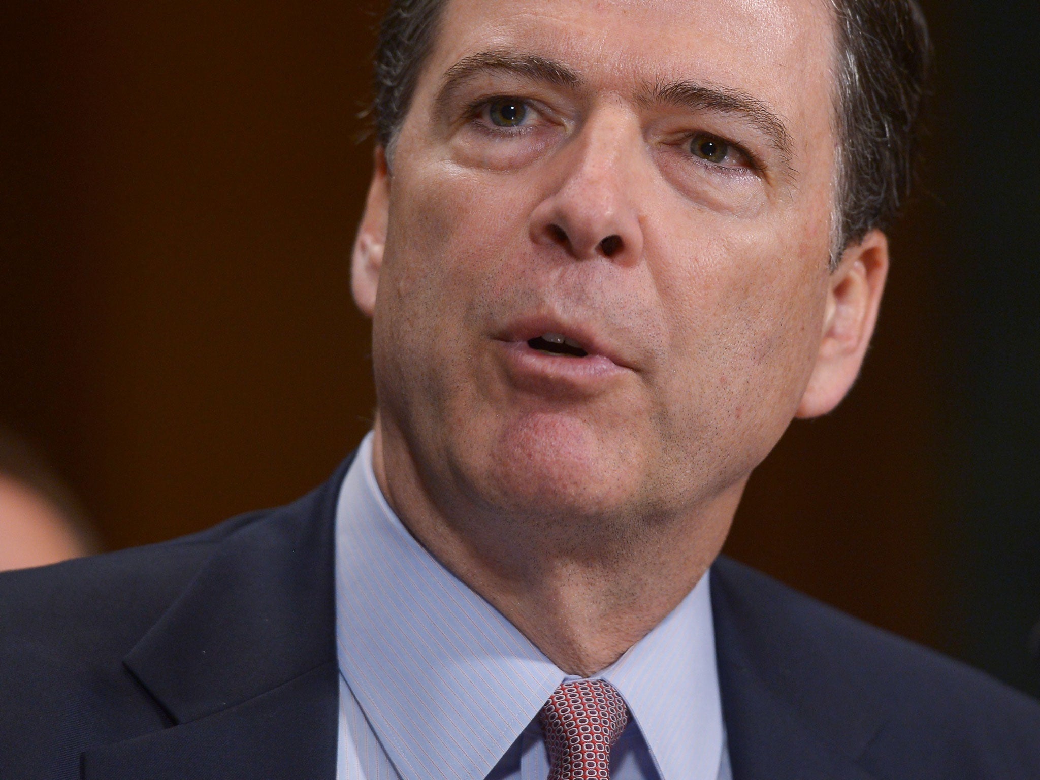 Federal Bureau of Investigation Director James Comey testifies during a hearing of the Senate Judiciary Committee in the Dirksne Senate Office Building on Capitol Hill May 21, 2014 in Washington, DC