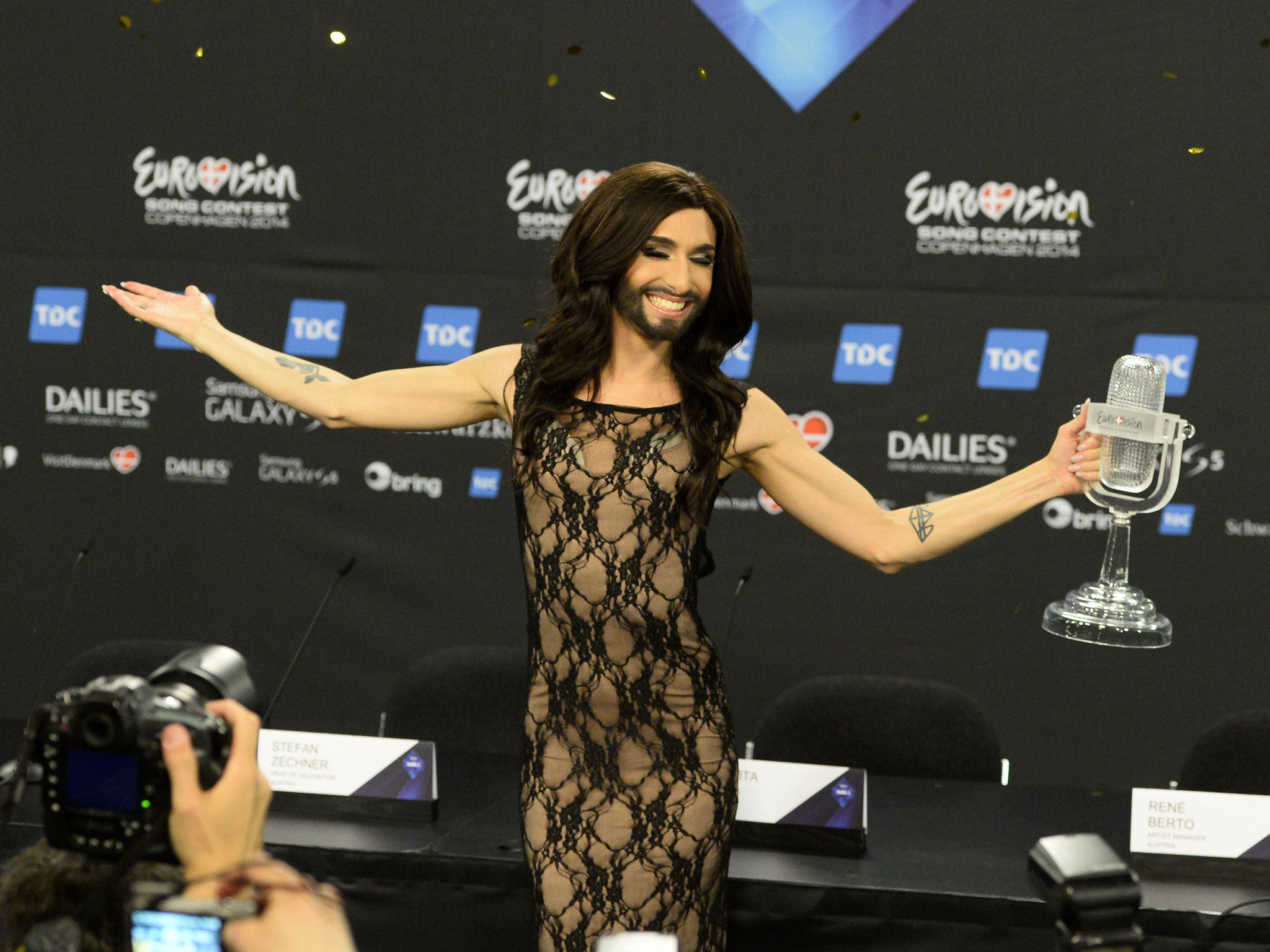 Conchita Wurst representing Austria poses with the trophy after a press conference after winning the Eurovision Song Contest 2014 Grand Final in Copenhagen
