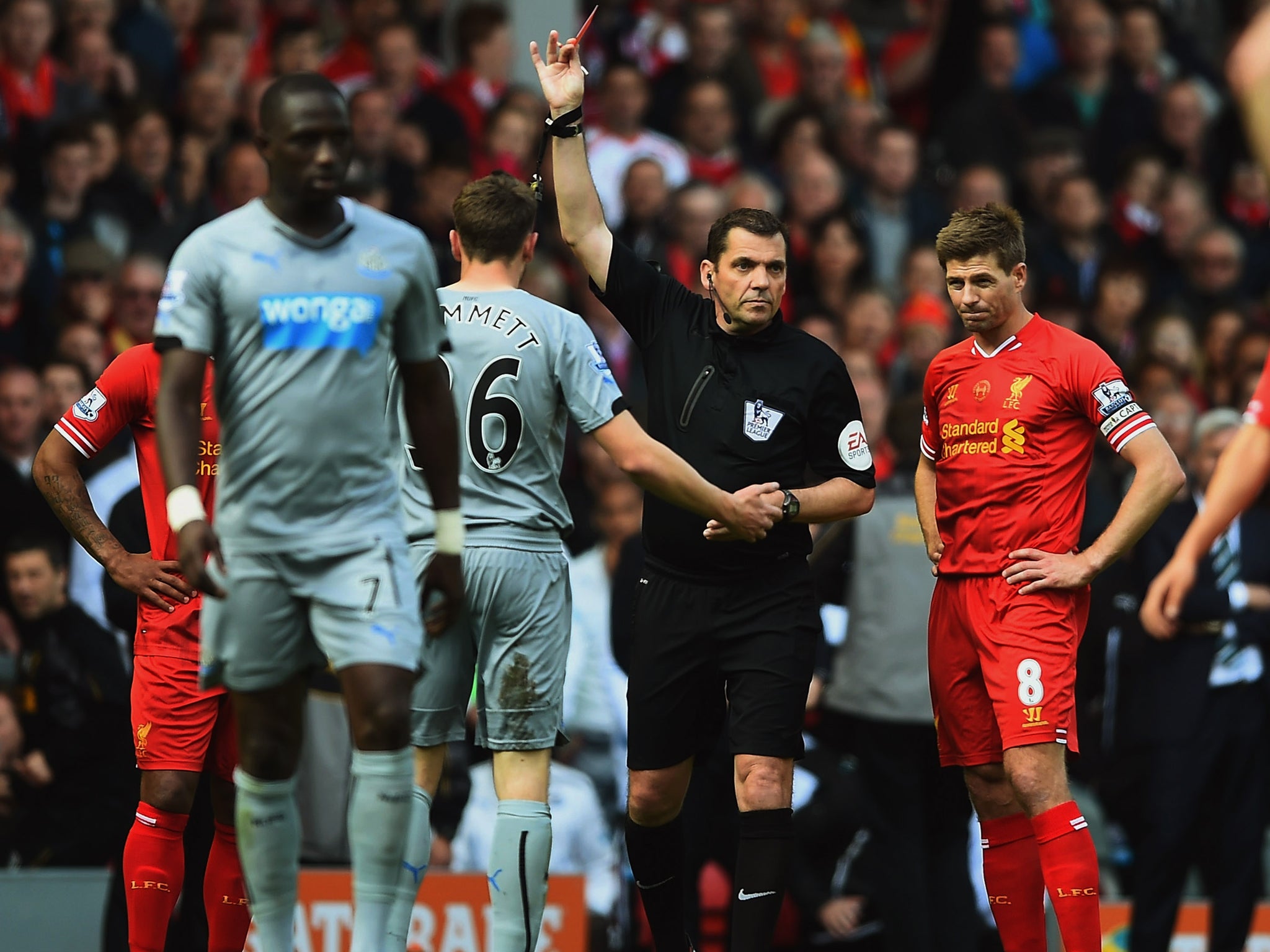 Paul Dummett of Newcastle United is sent off referee Phil Dowd during the Barclays Premier League match between Liverpool and Newcastle United at Anfield