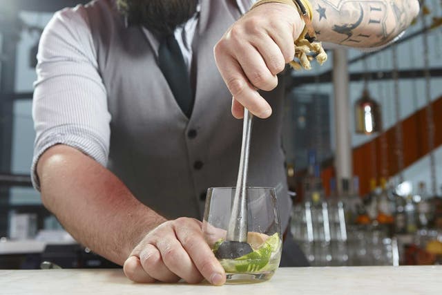 Sushi Samba's Richard Woods demonstrates how to muddle the lime pieces