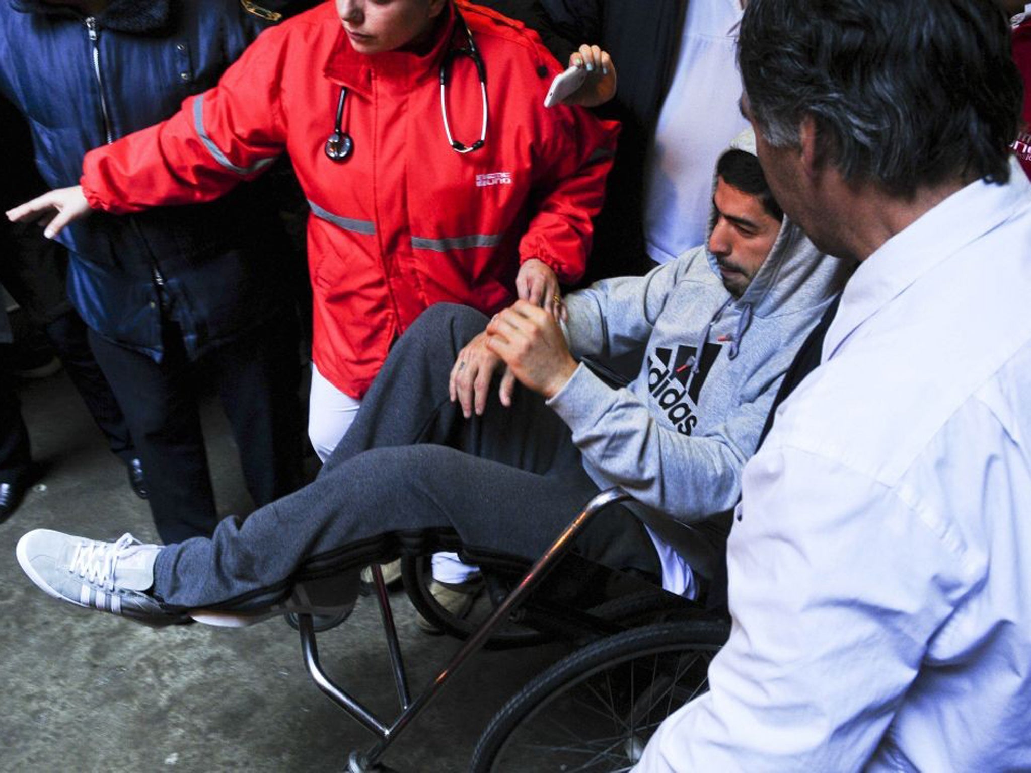 Luis Suarez leaves hospital after having surgery on his injured meniscus in his right knee