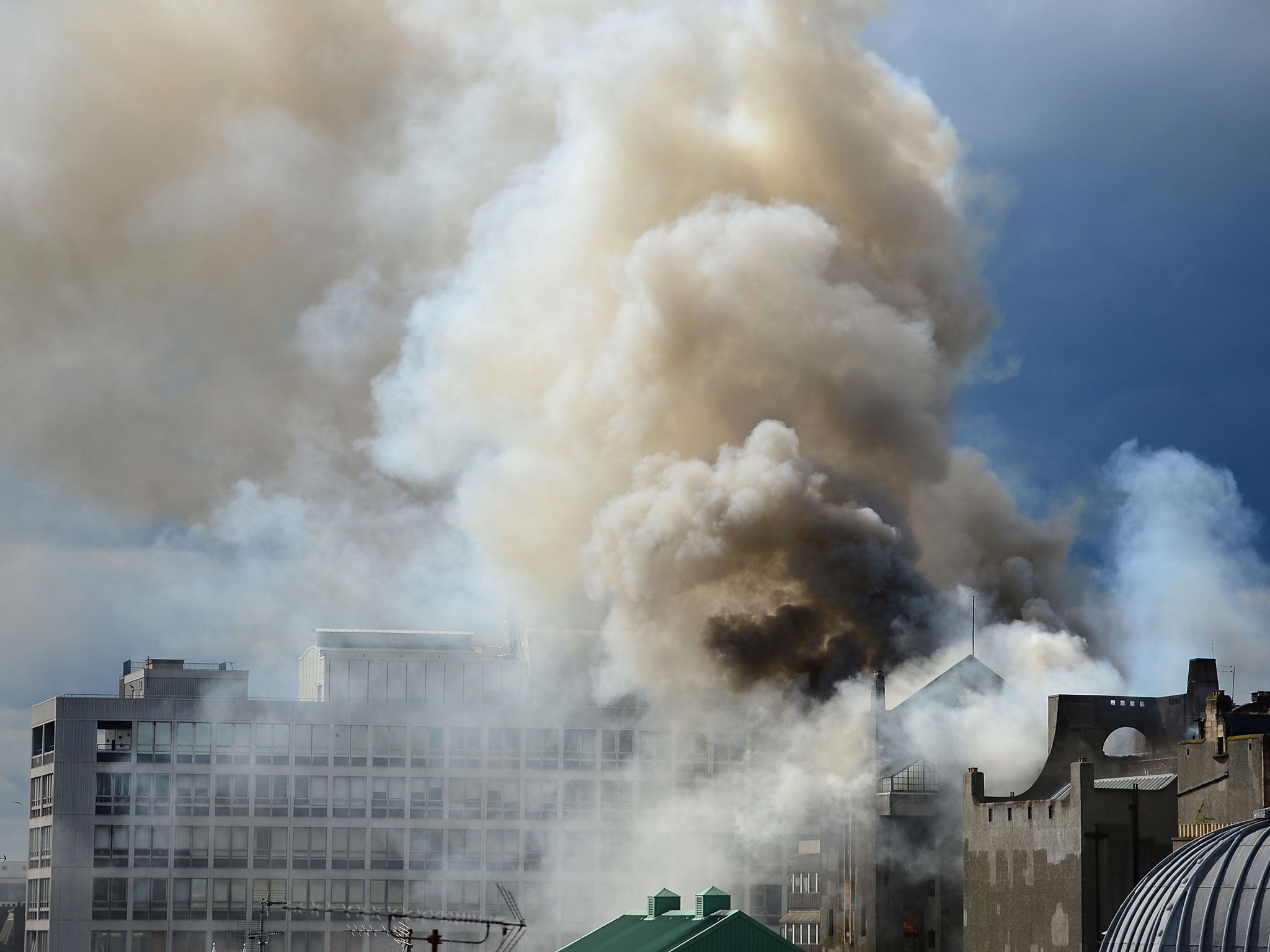 Smoke rises into the sky after a fire broke out at the Glasgow School of Art Charles Rennie Mackintosh Building in Glasgow