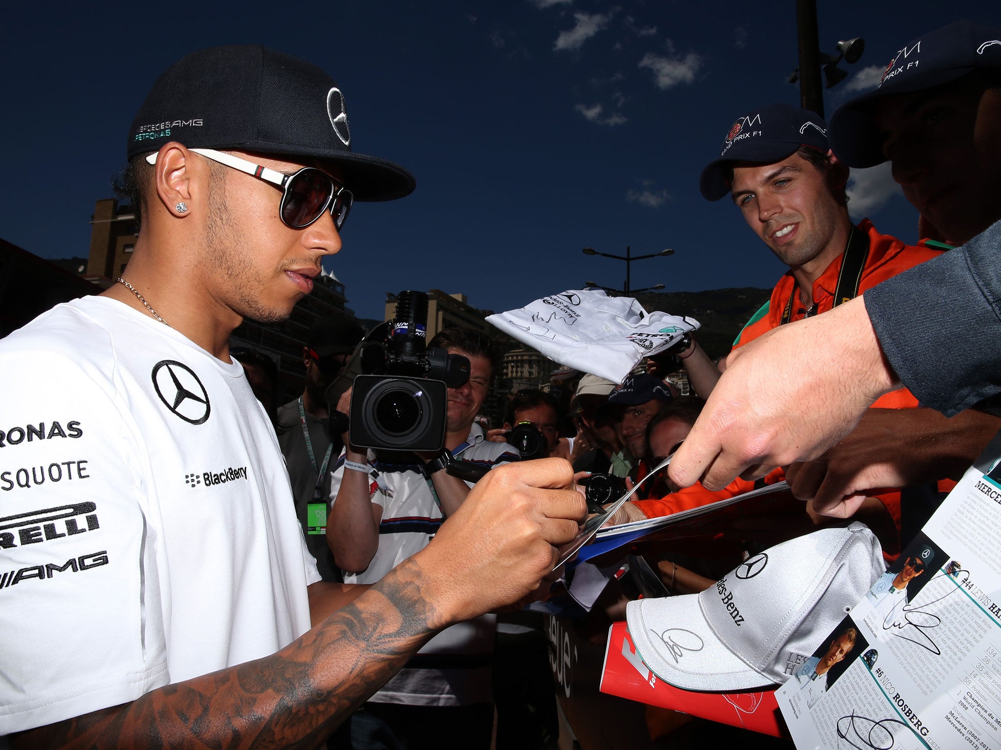 Lewis Hamilton signs autographs in Monaco on Friday
