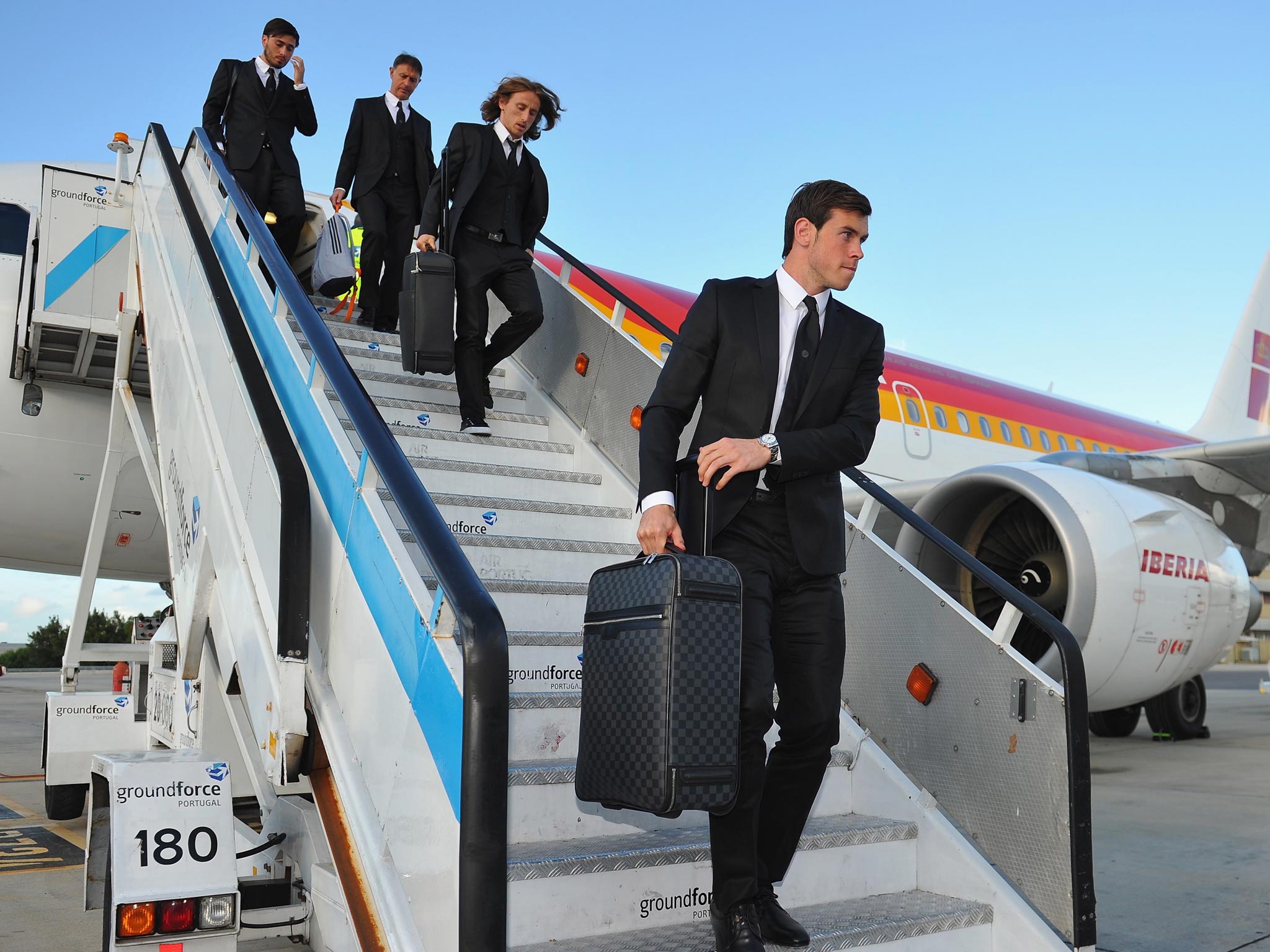 Gareth Bale (right) and his Real Madrid team-mates
arrive in Lisbon for the European Cup final