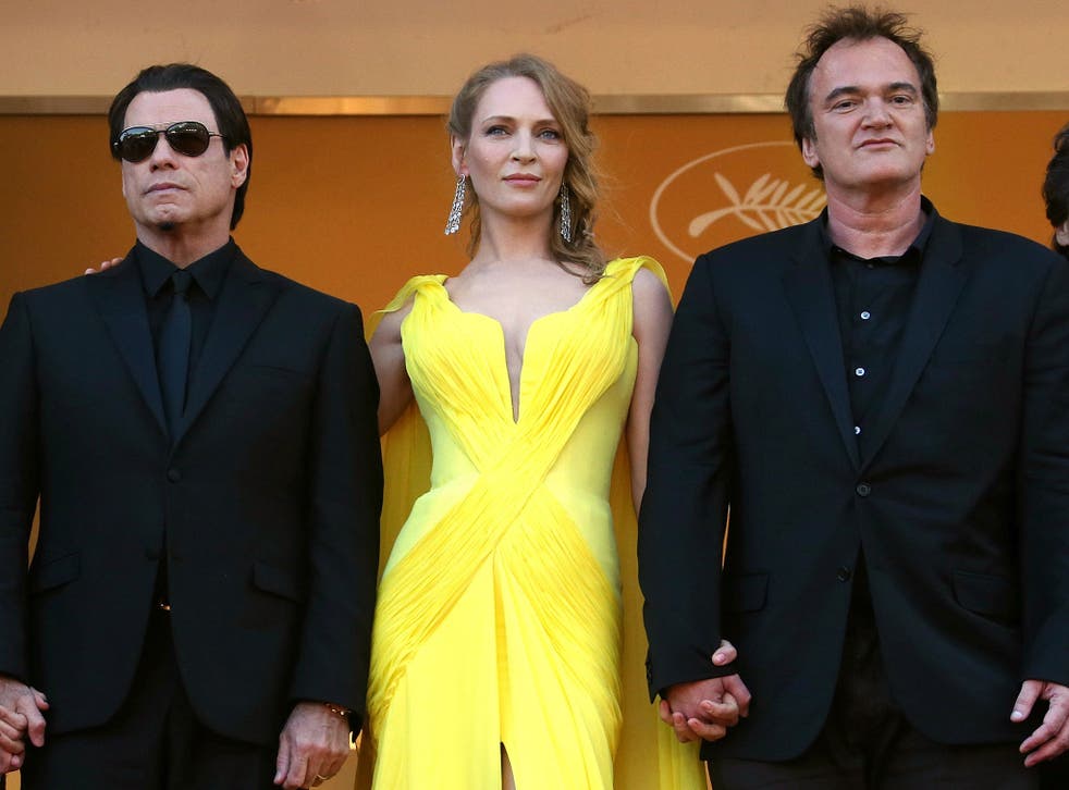 John Travolta, US actress Uma Thurman and US director Quentin Tarantino pose as they arrive for the screening of the film 'Sils Maria'