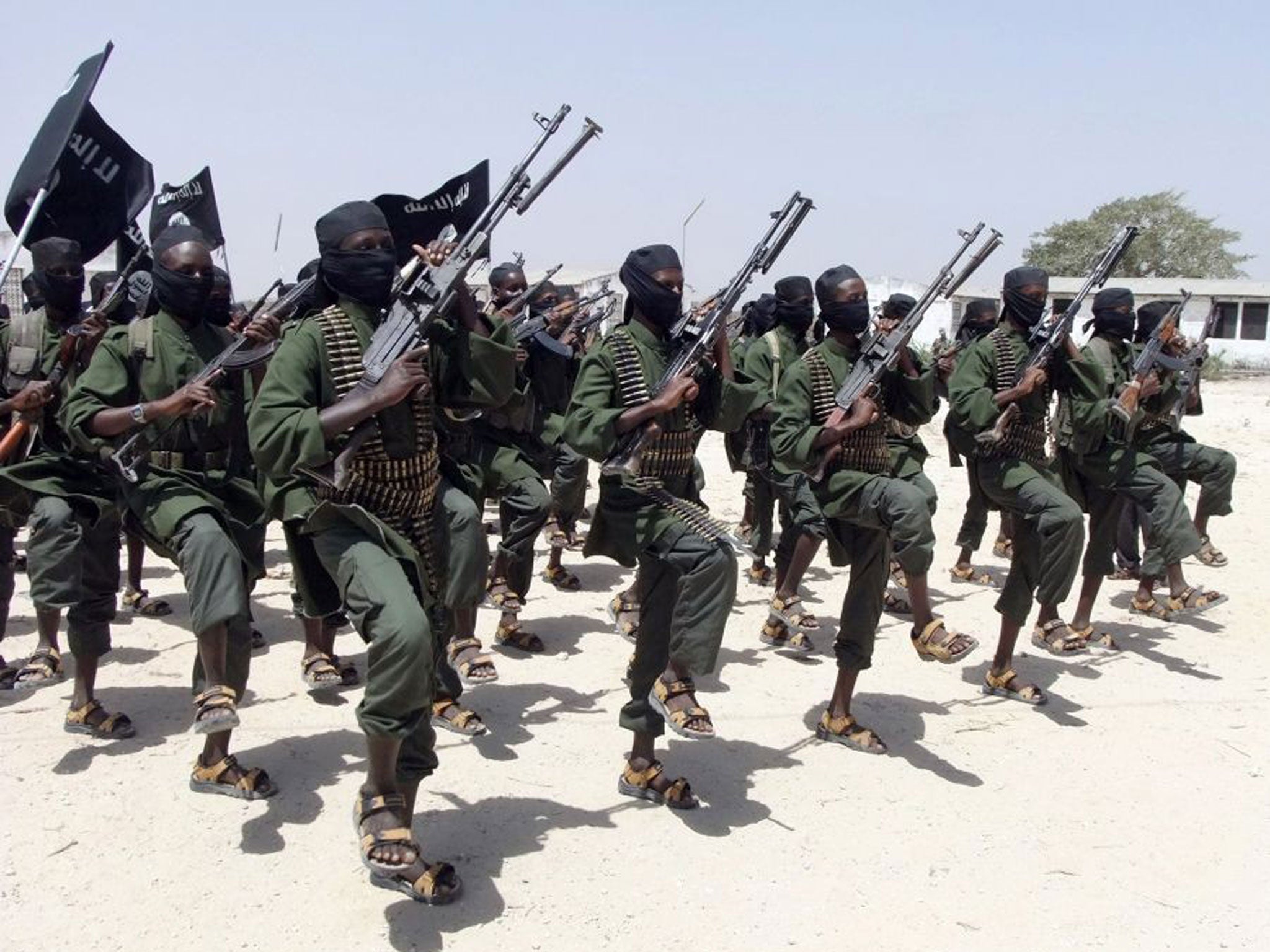 Pictured in 2011, hundreds of newly trained al-Shabaab fighters perform military exercises in the Lafofe area some 18km south of Mogadishu, in Somalia