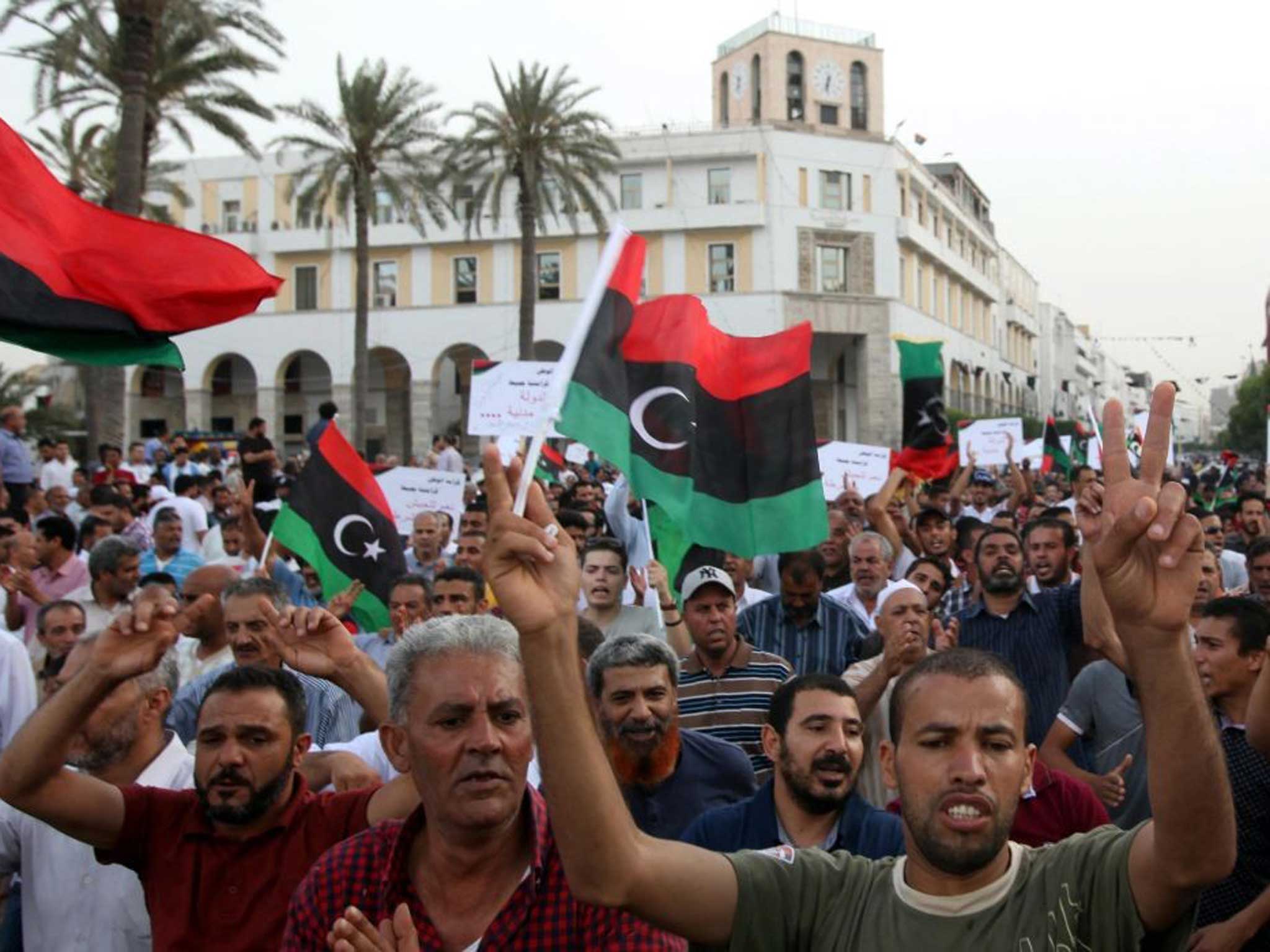 Defiant mood: Thousands of Libyans took to the streets on Friday in support of Hifter and to demand the suspension of the Islamist-led parliament