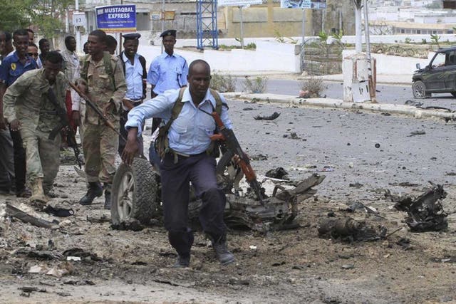 Somali soldiers and police clash with al-Shabaab militants yesterday 