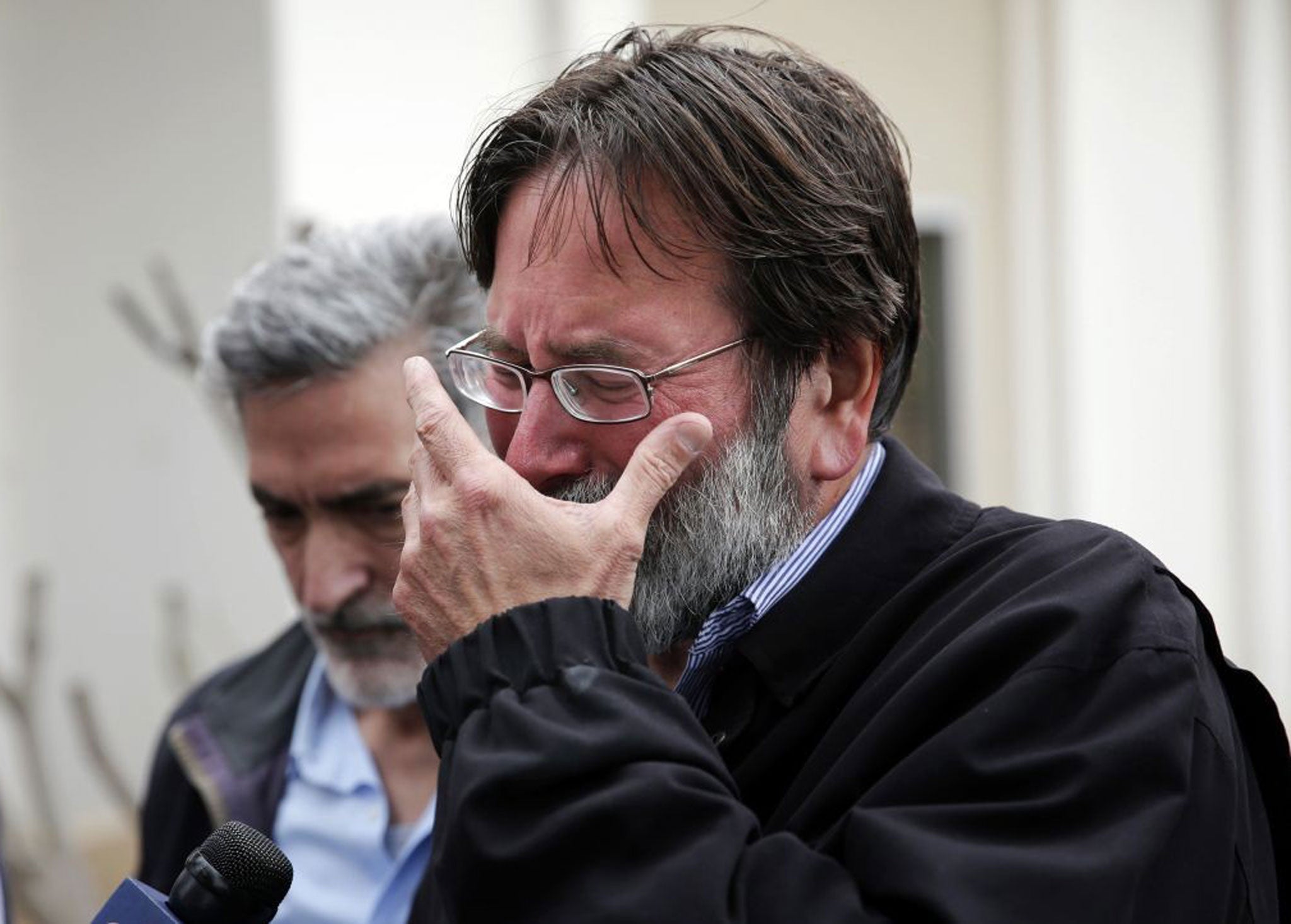 Richard Martinez who says his son Christopher Martinez was killed in Friday night's mass shooting, , breaks down as he talks to media outside the Santa Barbara County Sheriff's Headquarters on Saturday