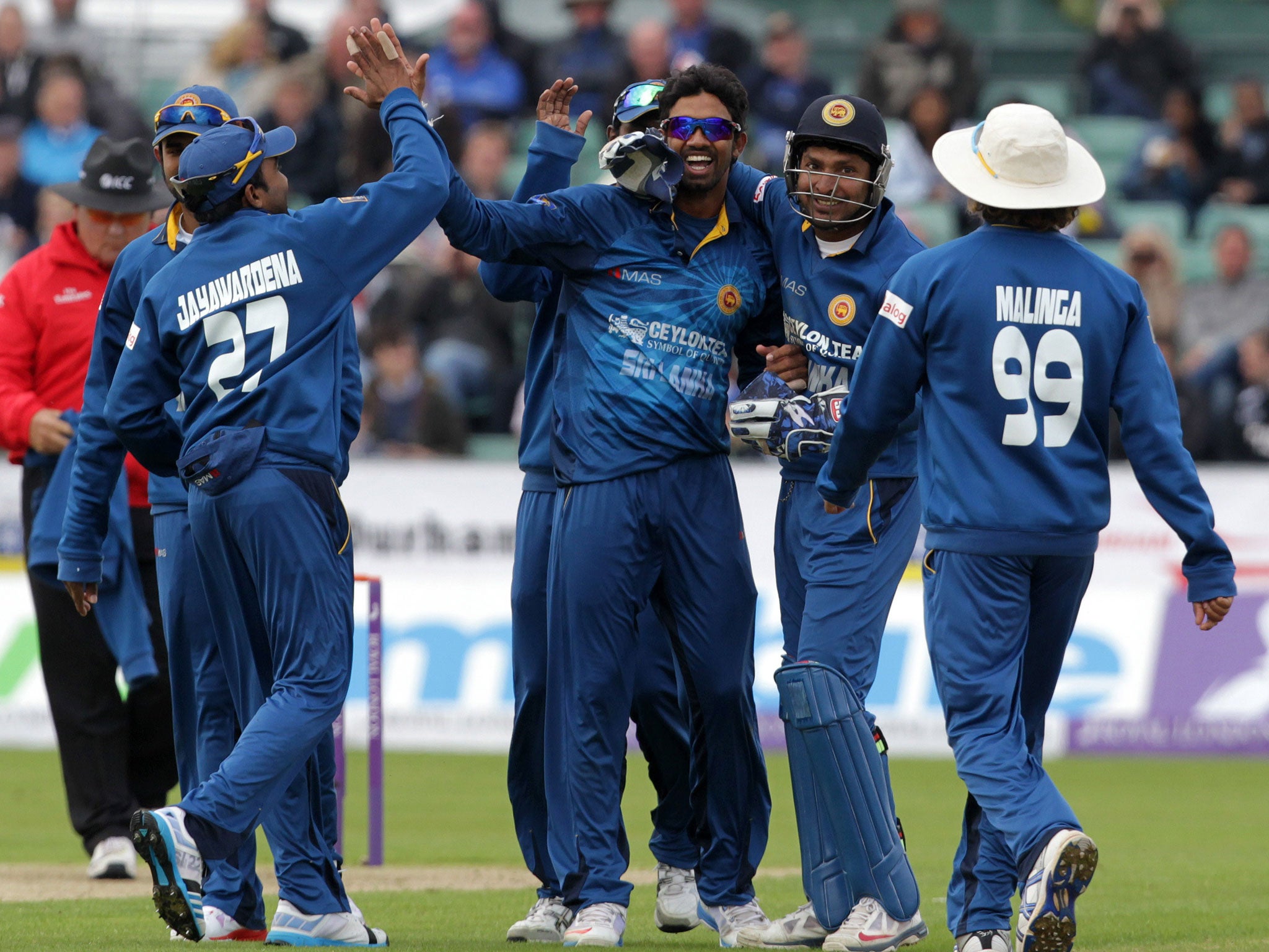 Sachithra Senanayake (centre) celebrates bowling Ravi Bopara