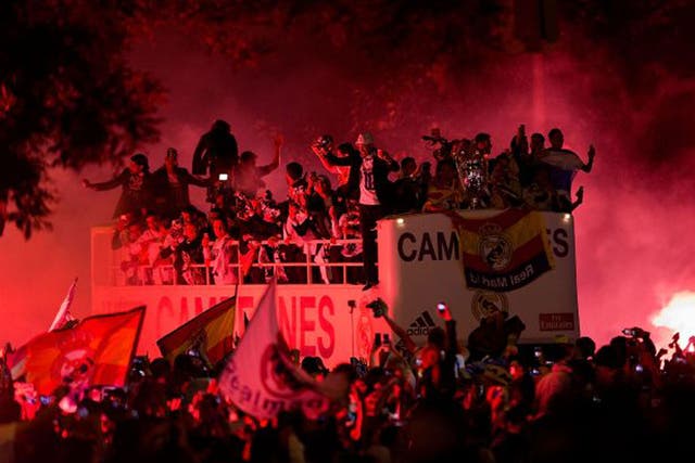 The Real Madrid team arrives at Cibeles square on Sunday