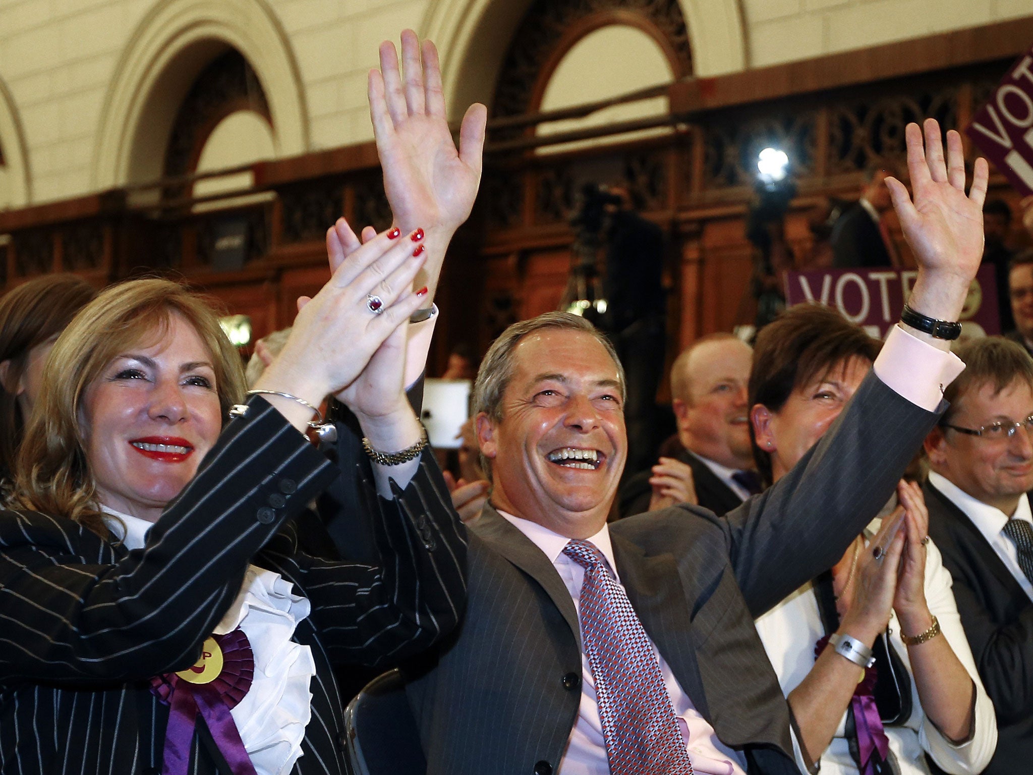 Ukip leader Nigel Farage celebrates with fellow MEP candidate Janice Atkinson, left, as he hears the results