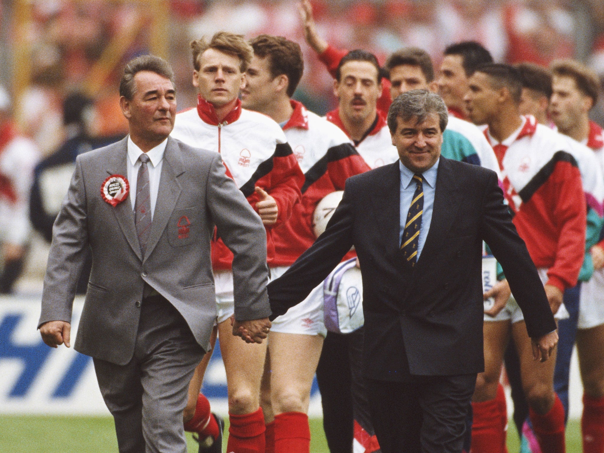 Brian Clough and Terry Venables hold hands as they walk on the Wembley pitch before Nottingham Forest played Tottenham in the 1991 FA Cup final