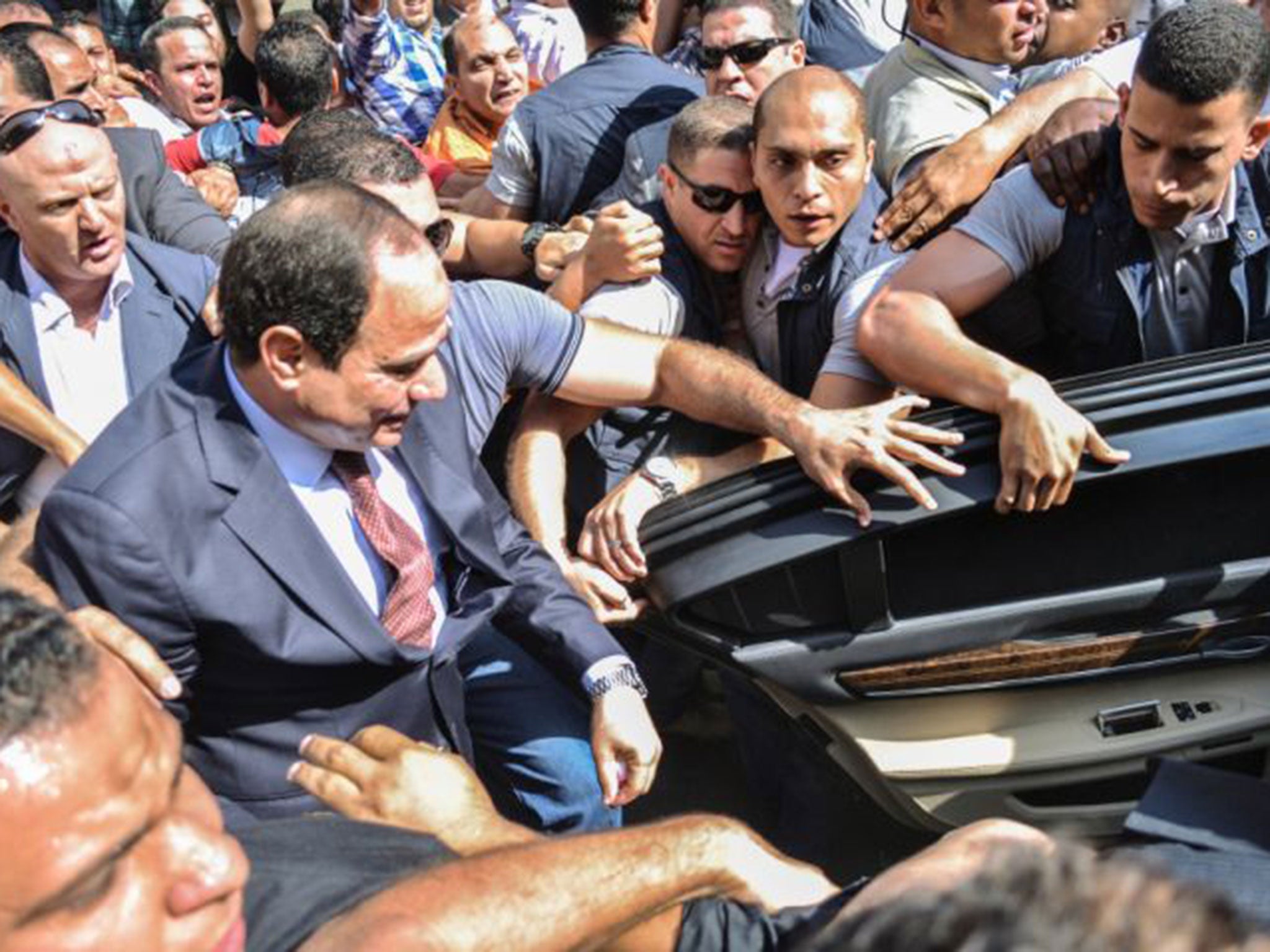 Sisi (centre) led the coup last year against Morsi