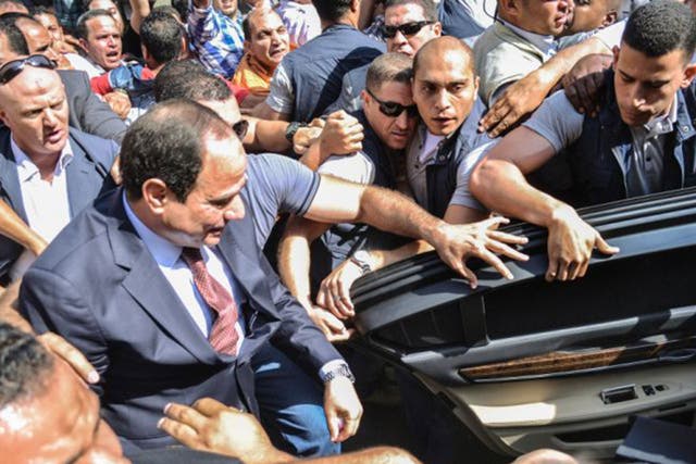 Sisi (centre) led the coup last year against Morsi