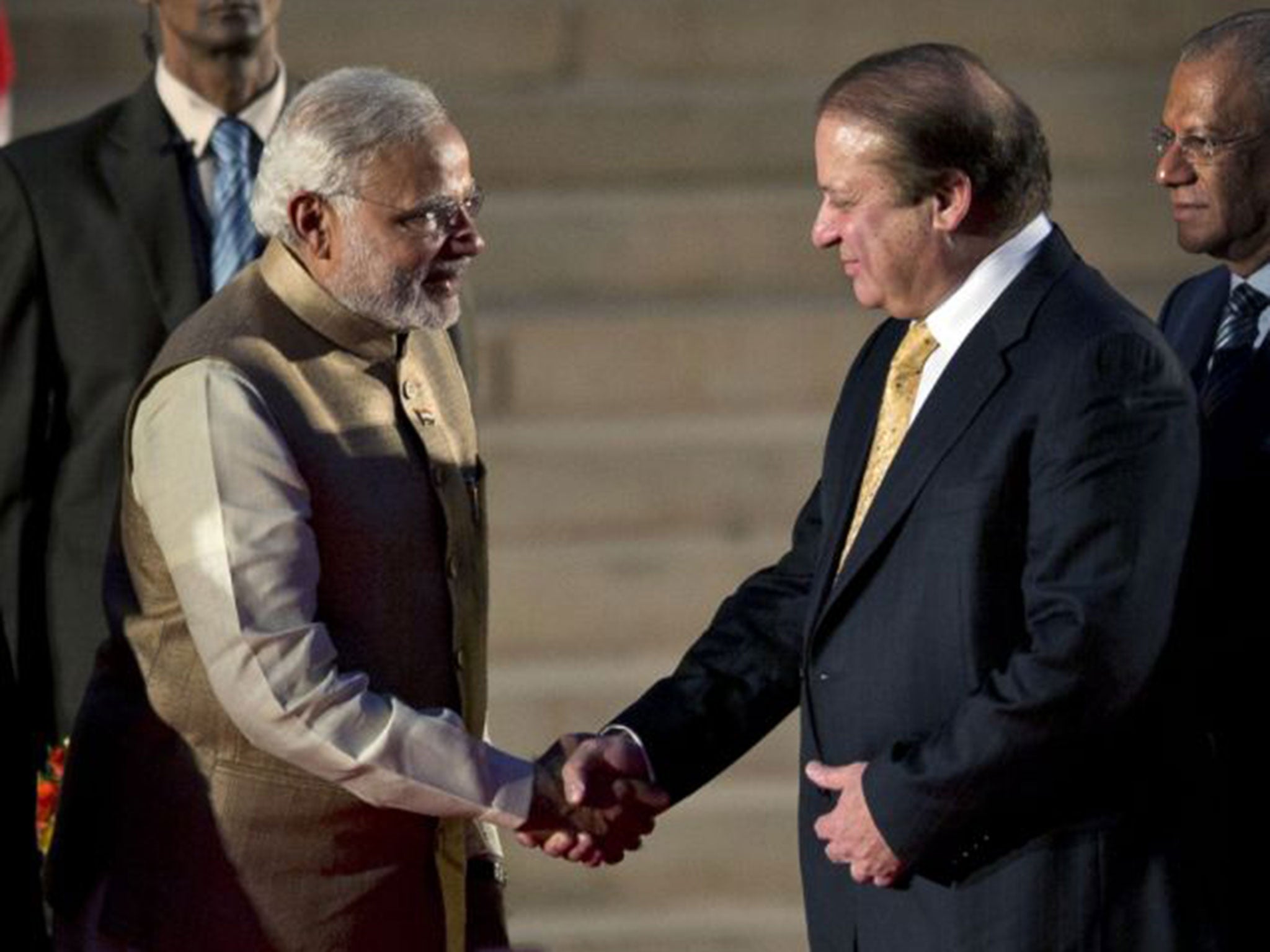 Indian Prime Minister Narendra Modi and his Pakistani counterpart Nawaz Sharif shake hands at Modi's inauguration