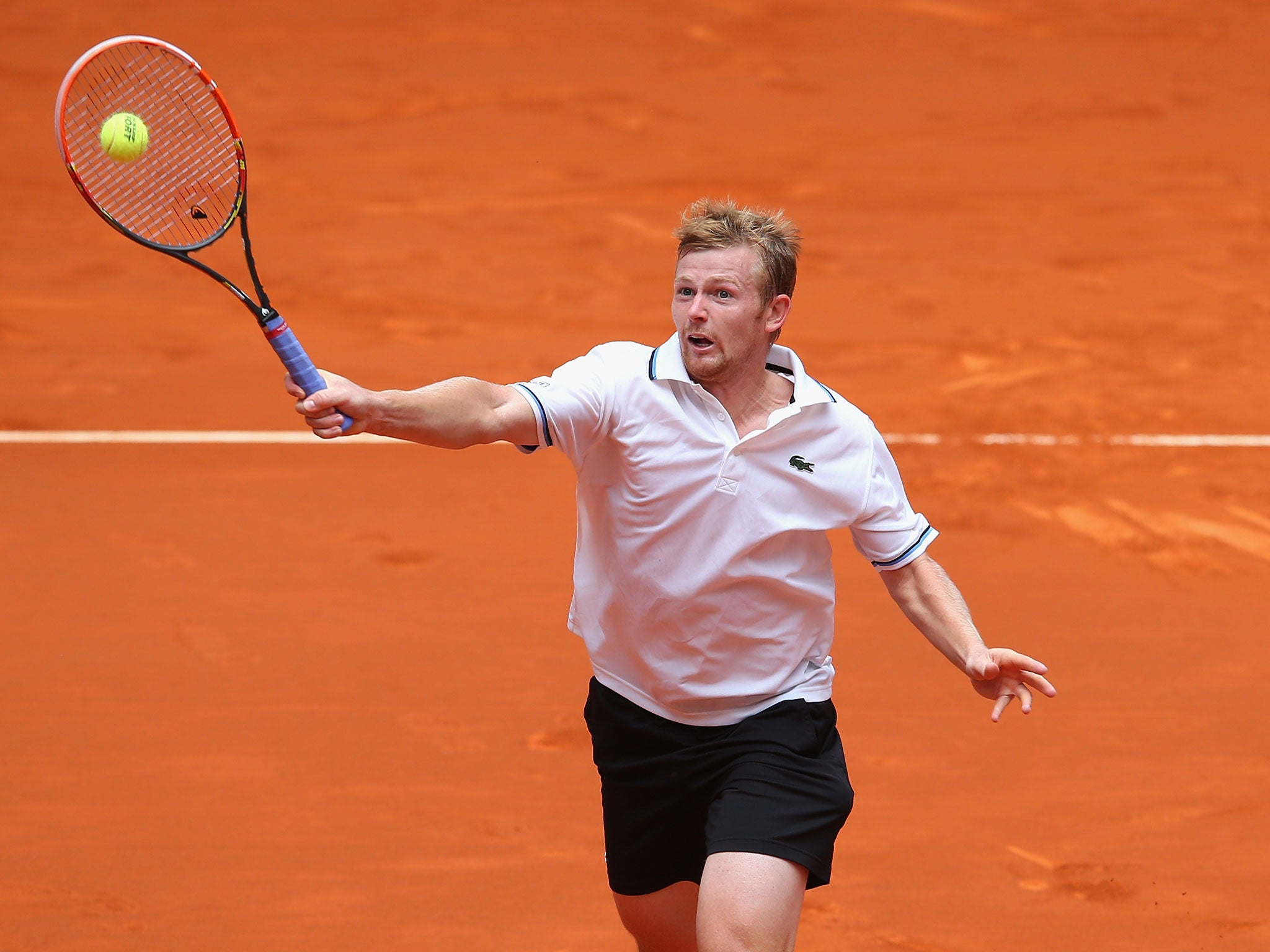 Andrey Golubev plays a volley at the Madrid Open earlier this month