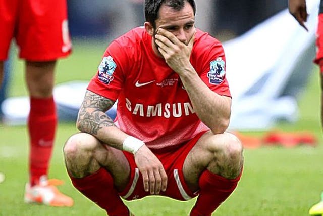 Chris Dagnall, of Leyton Orient, is distraught after missing the final penalty at Wembley