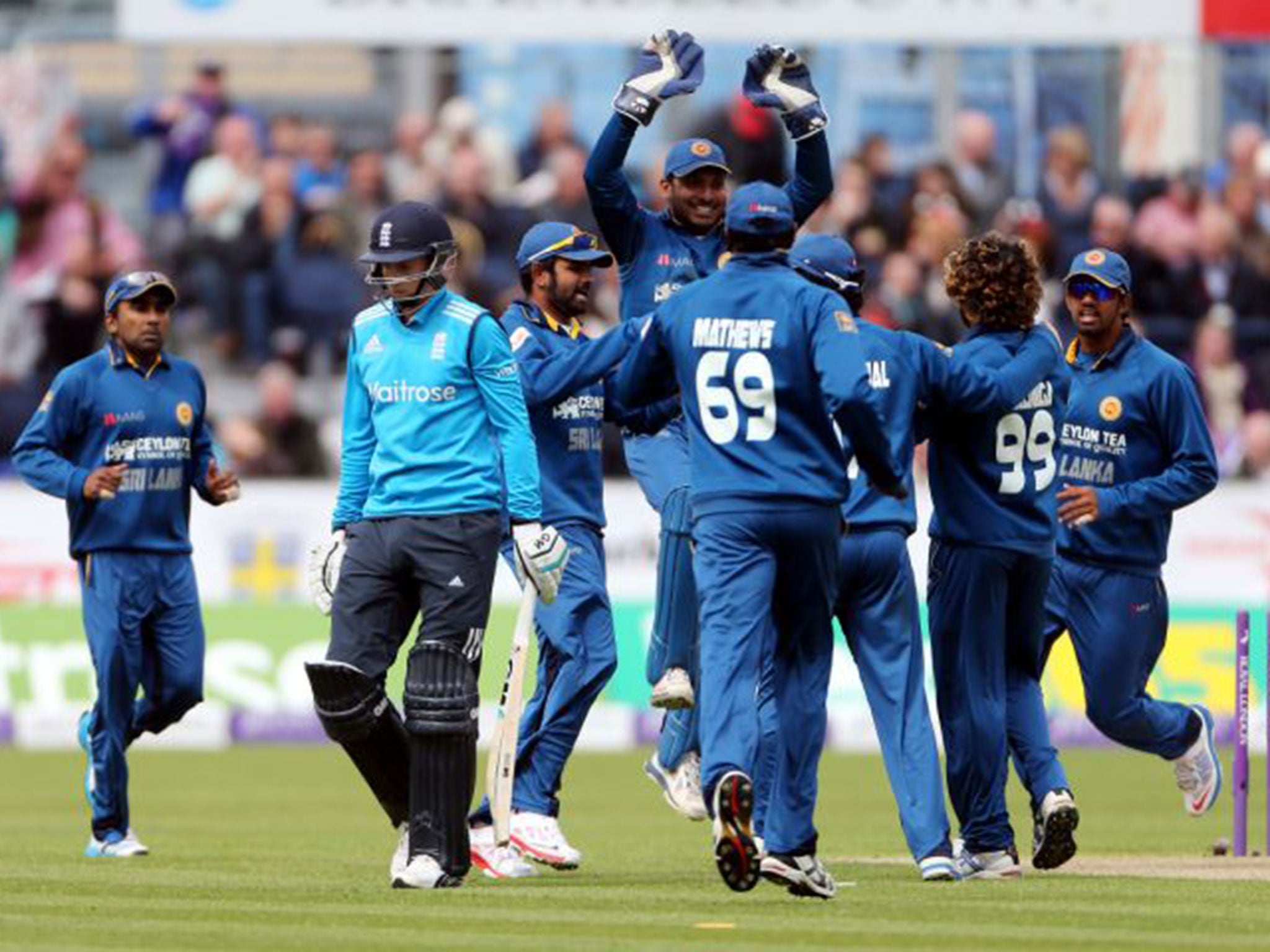 Joe Root trudges off the field after being bowled out by Lasith Malinga for a duck