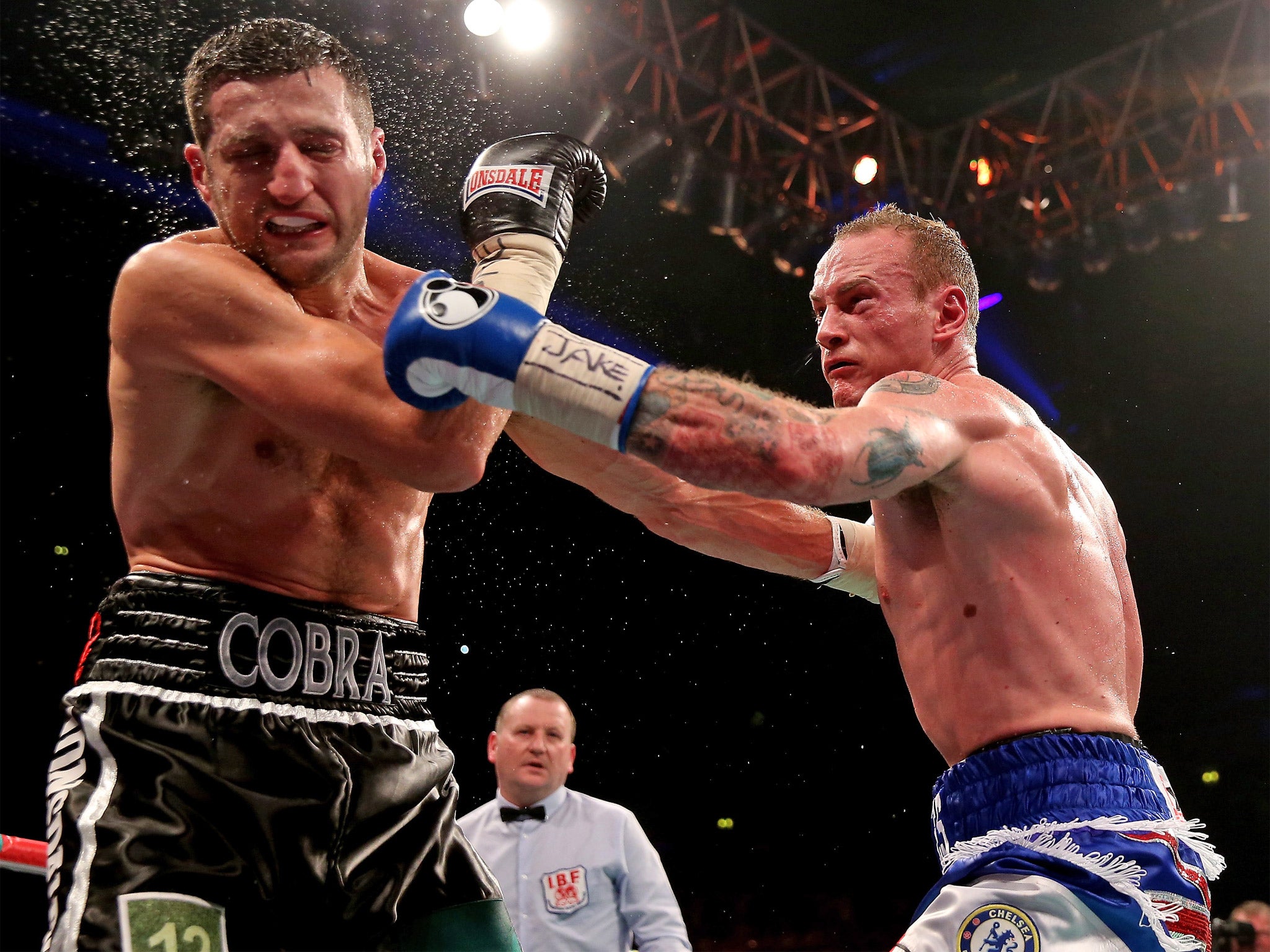 George Groves lands a stiff left on Carl Froch's chin during their controversial first fight
