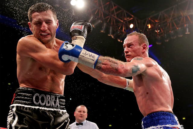 George Groves lands a stiff left on Carl Froch's chin during their controversial first fight