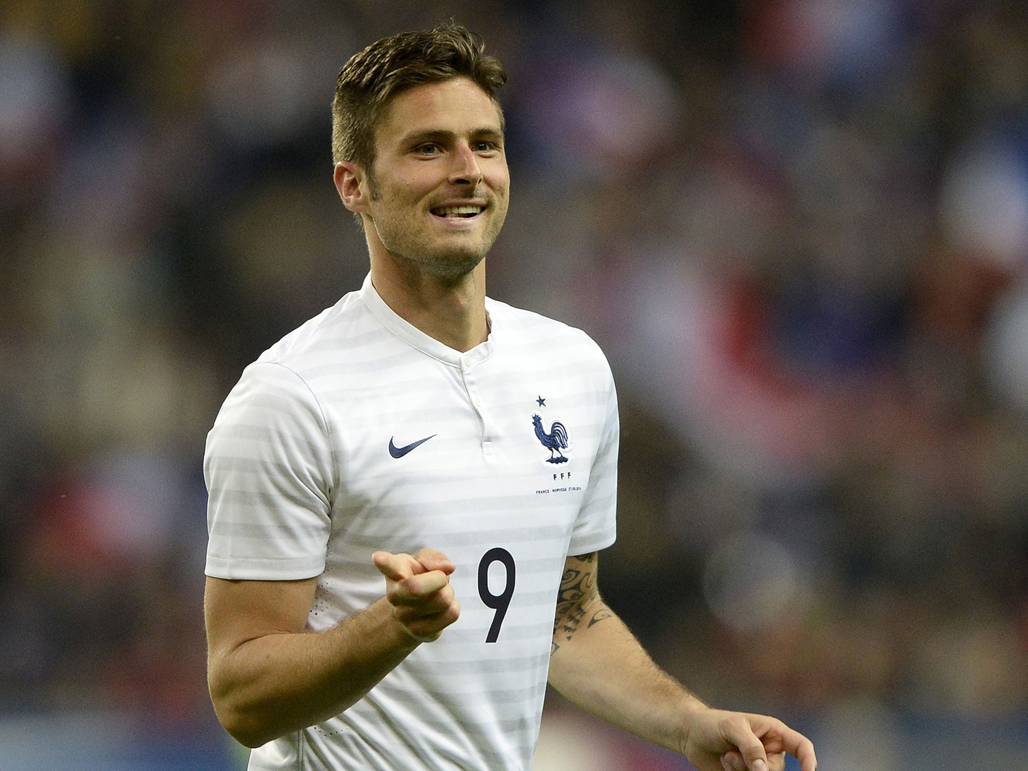 France's forward Olivier Giroud gestures as he celebrates his first goal against Norway