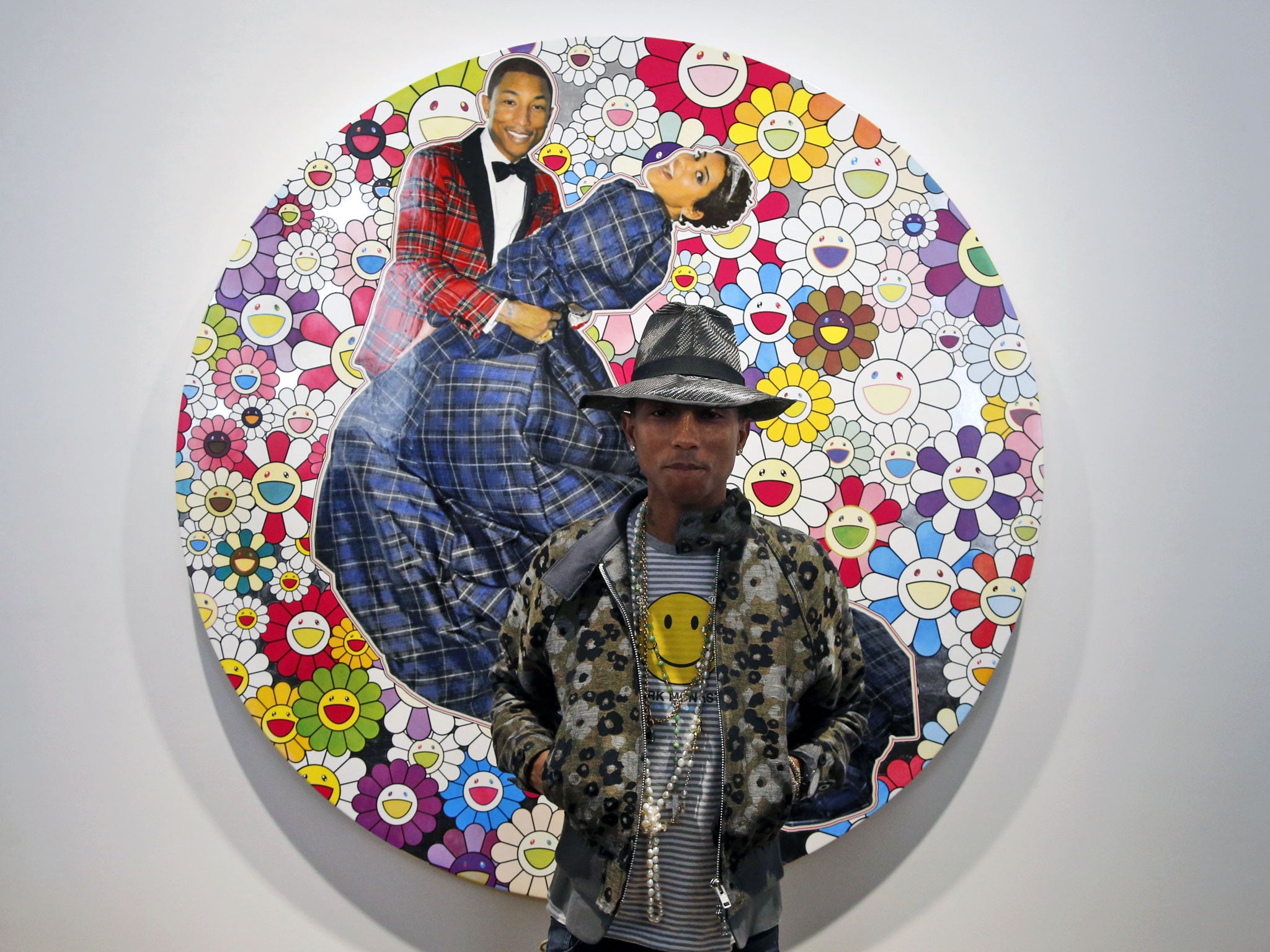 US singer Pharrell Williams poses during a press conference for the exhibition "GIRL" at the Perrotin Gallery in Paris
