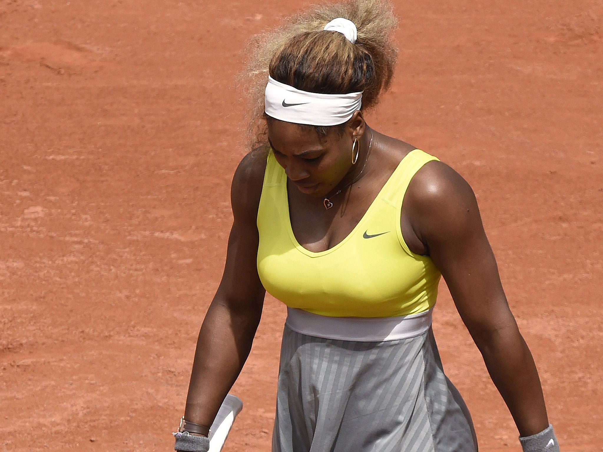 Serena Williams reacts during her second-round defeat by Garbine Muguruza