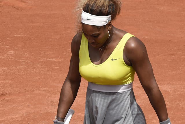 Serena Williams reacts during her second-round defeat by Garbine Muguruza 