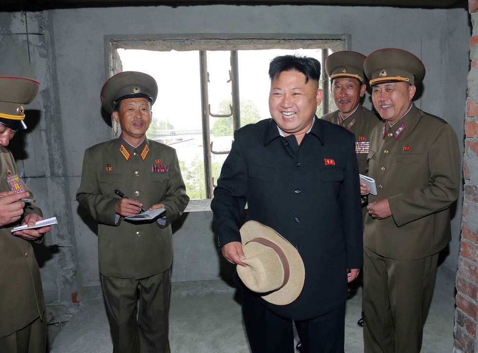 Kim Jong-un touring an apartment construction site in Pyongyang