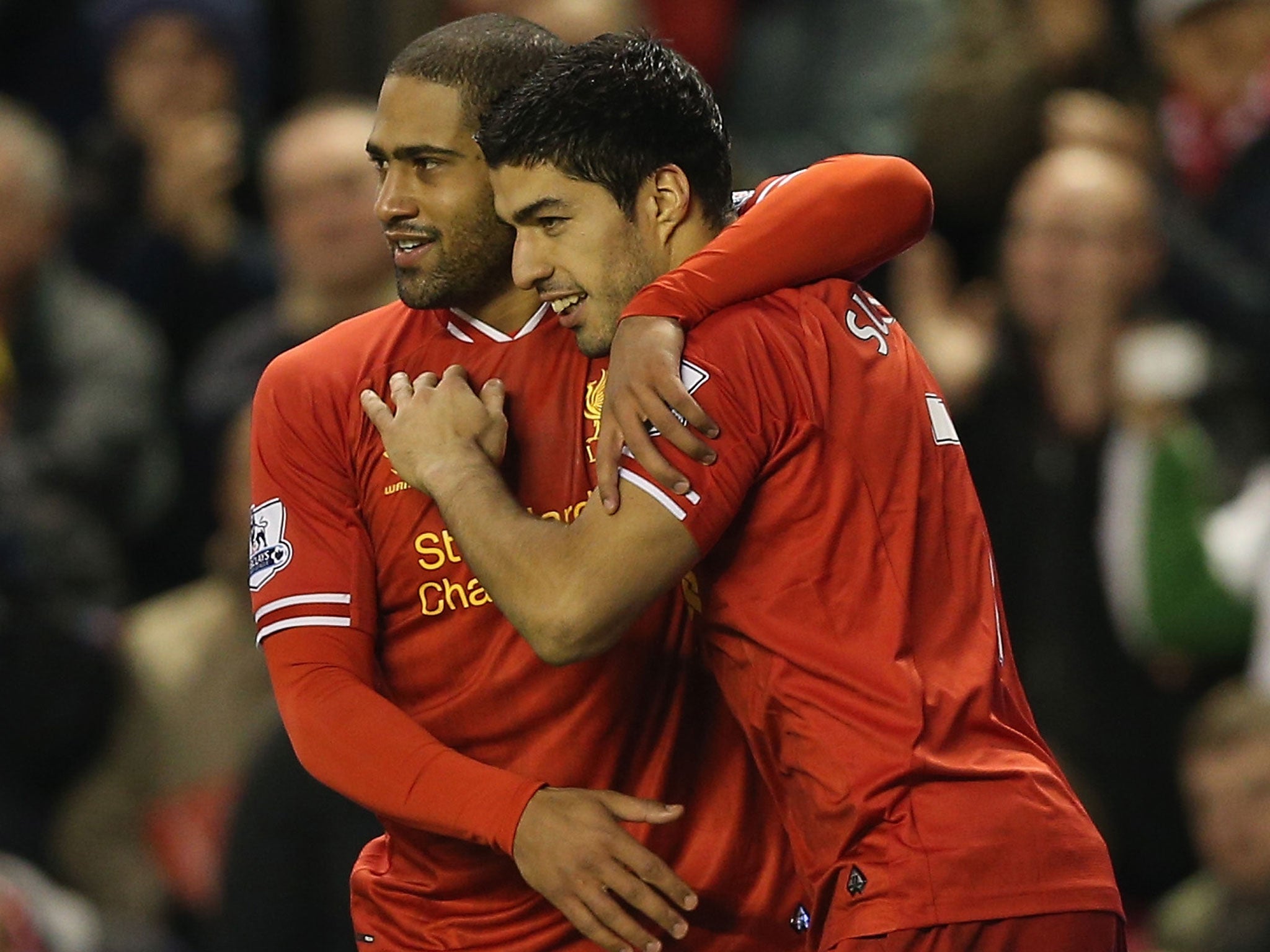 Glen Johnson (right) and Luis Suarez celebrate for Liverpool