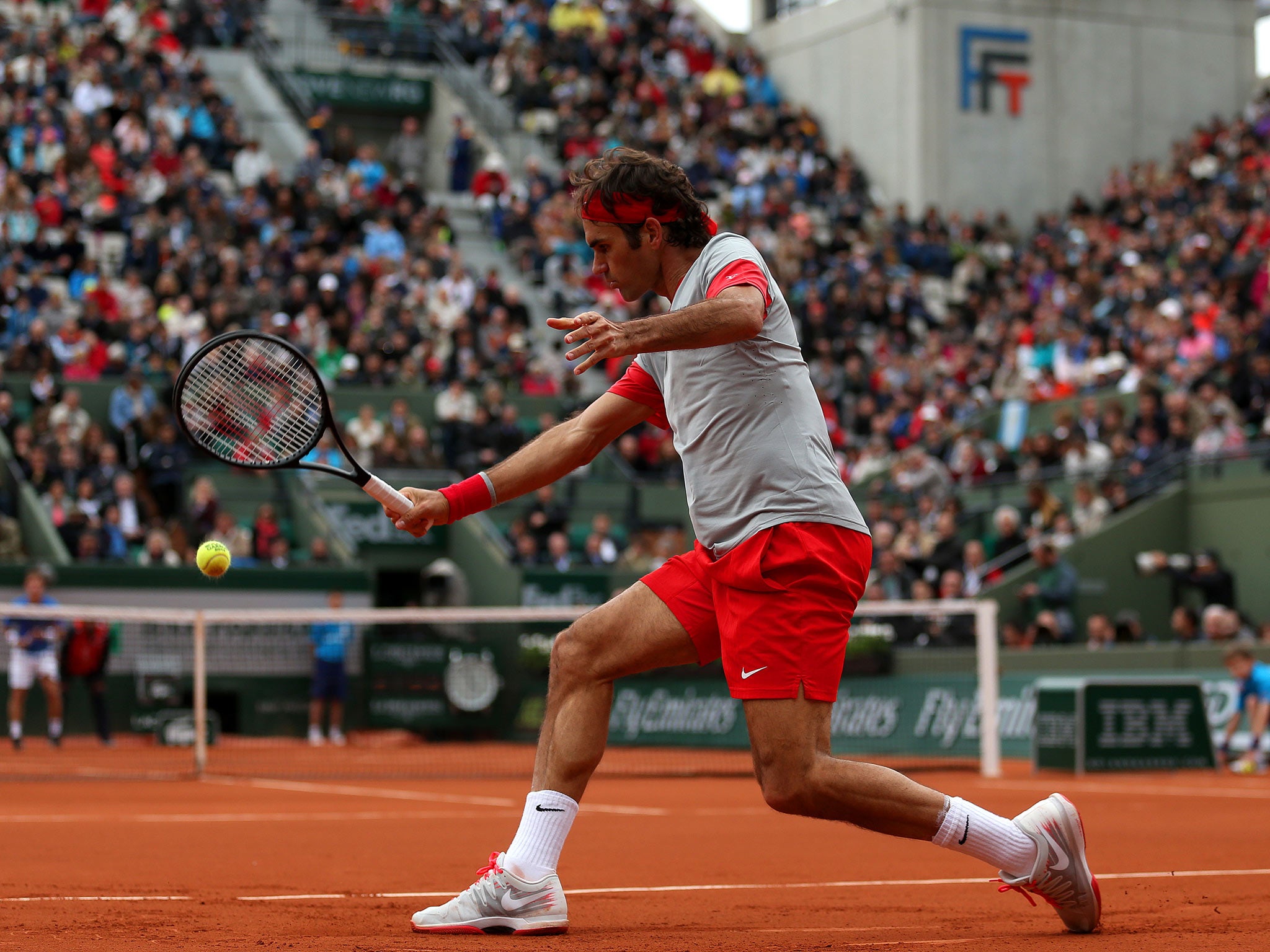 Roger Federer of Switzerland returns a shot during his men's singles match against Diego Sebastian Schwartzman of Argentina on day four of the French Open