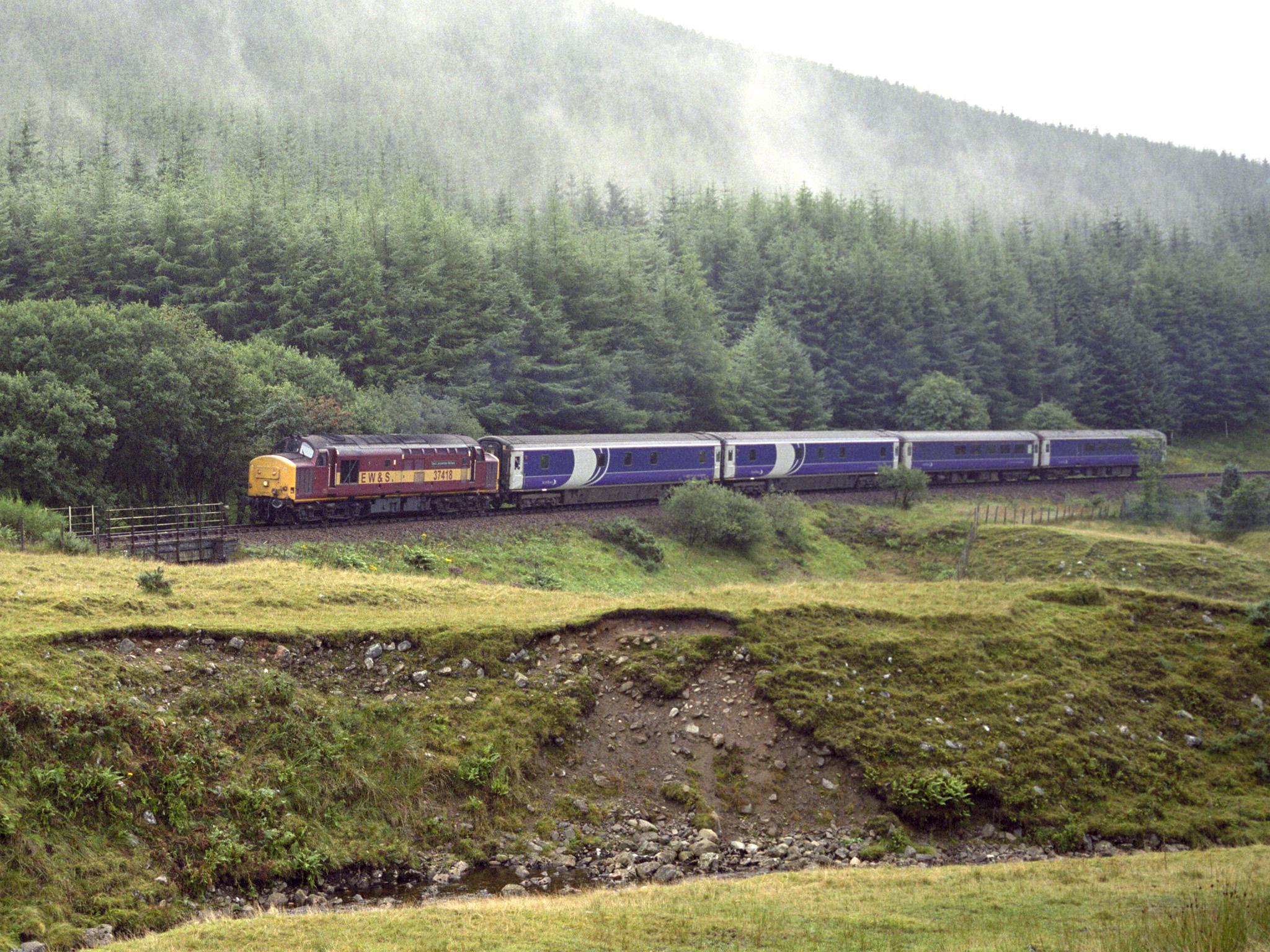 Caledonian Sleeper from London Euston Station approaching the Horseshoe Curve on the West Highland Line