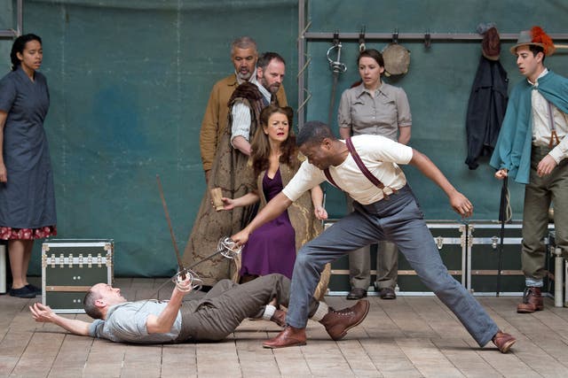 Members of the cast of a new touring production of William Shakespeare's 'Hamlet' perform at the Globe theatre in London 