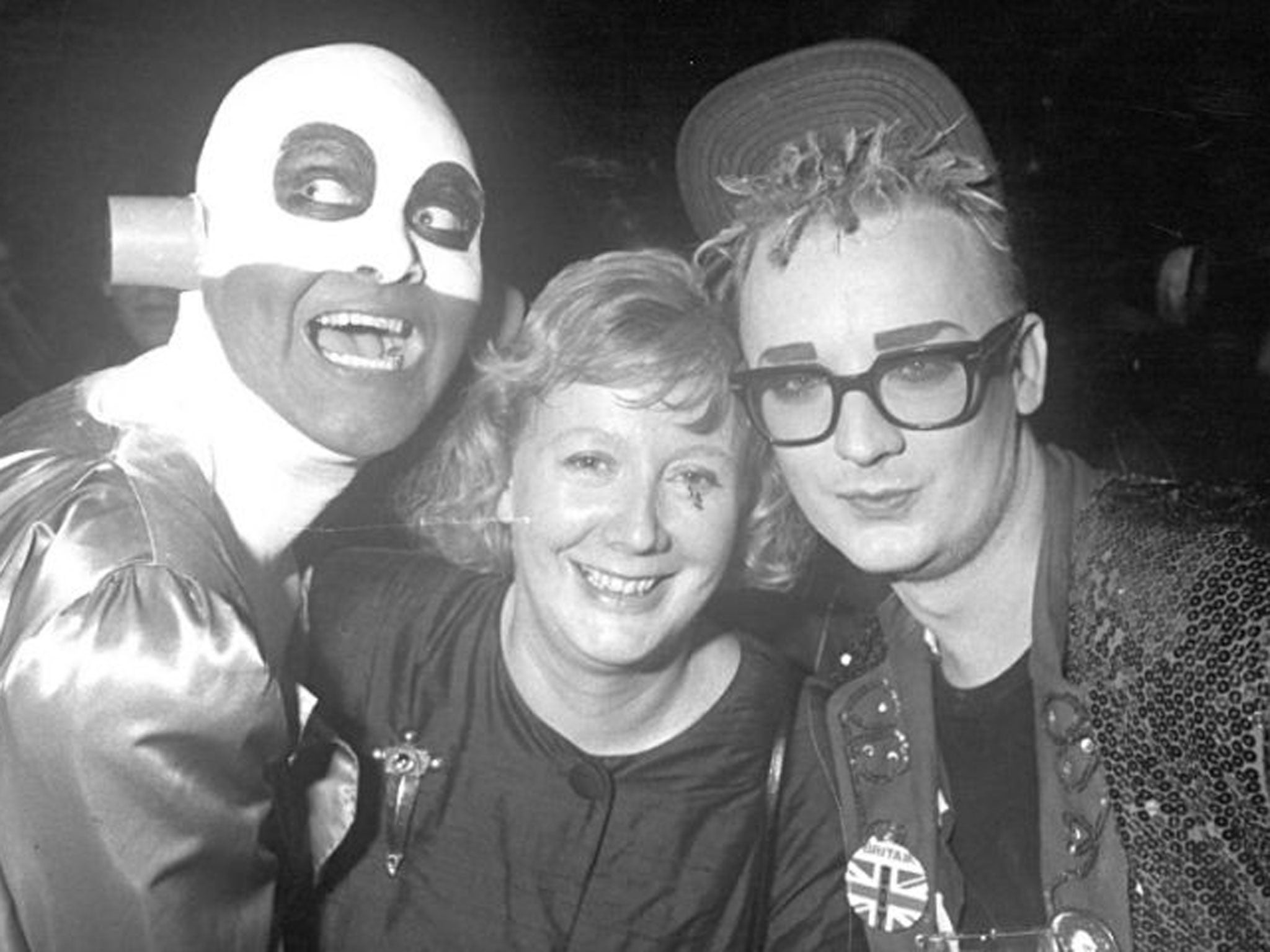 Central player in the music-promo revolution: Watts, centre, with Boy George, right
