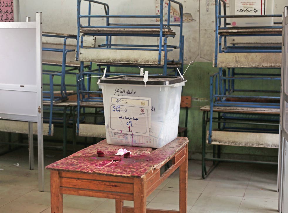 A ballot box sits in an empty polling station in Cairo
