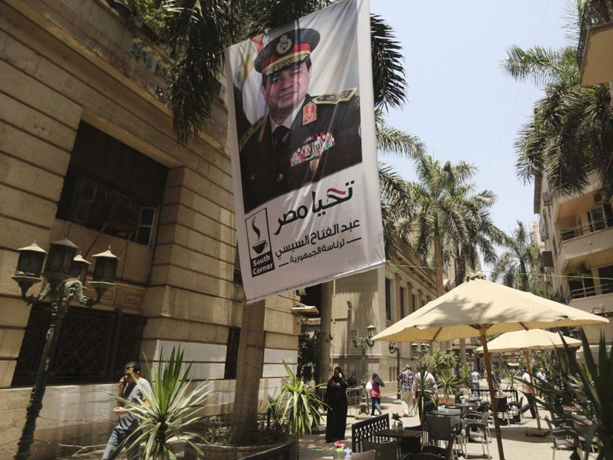 A poster of Abdel Fattah al-Sisi hangs outside the stock exchange in Cairo